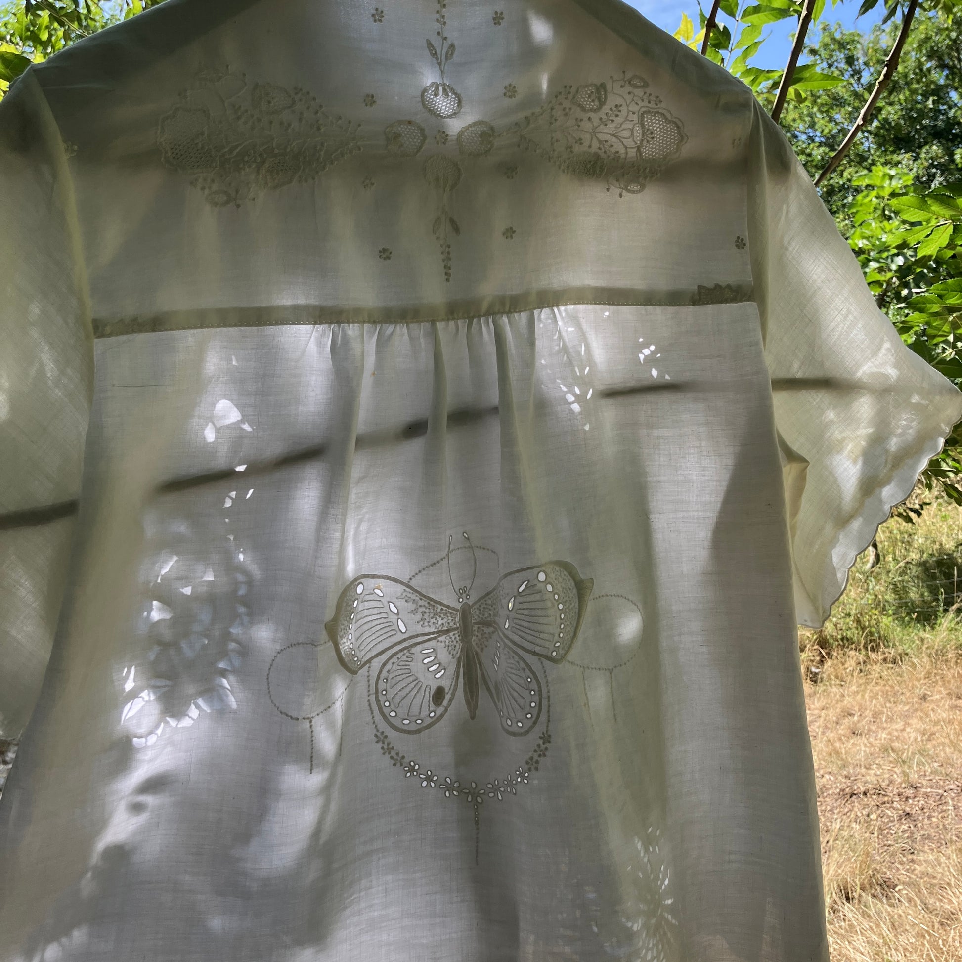 shirt made from a patchwork of recycled vintage white table linen