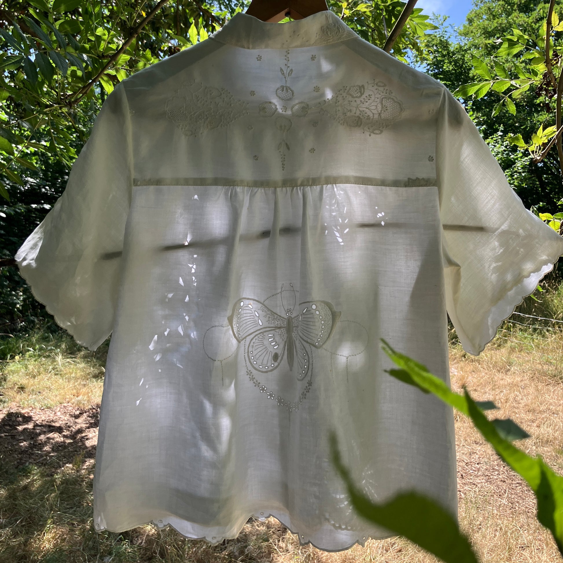 shirt made from a patchwork of recycled vintage white table linen