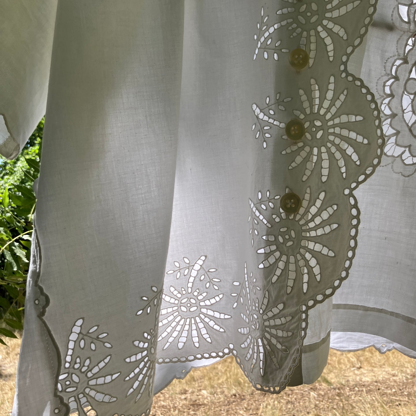 shirt made from a patchwork of recycled vintage white table linen