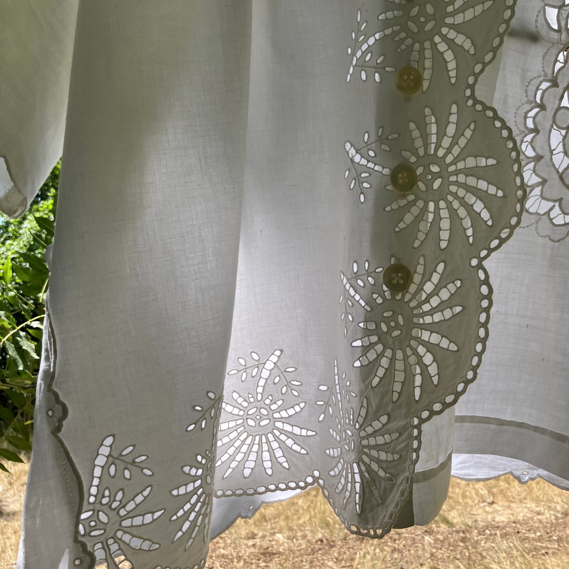 shirt made from a patchwork of recycled vintage white table linen