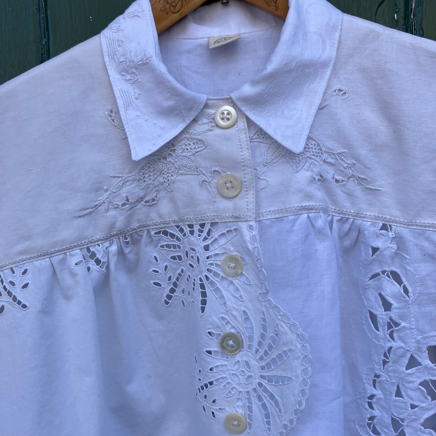 shirt made from a patchwork of recycled vintage white table linen