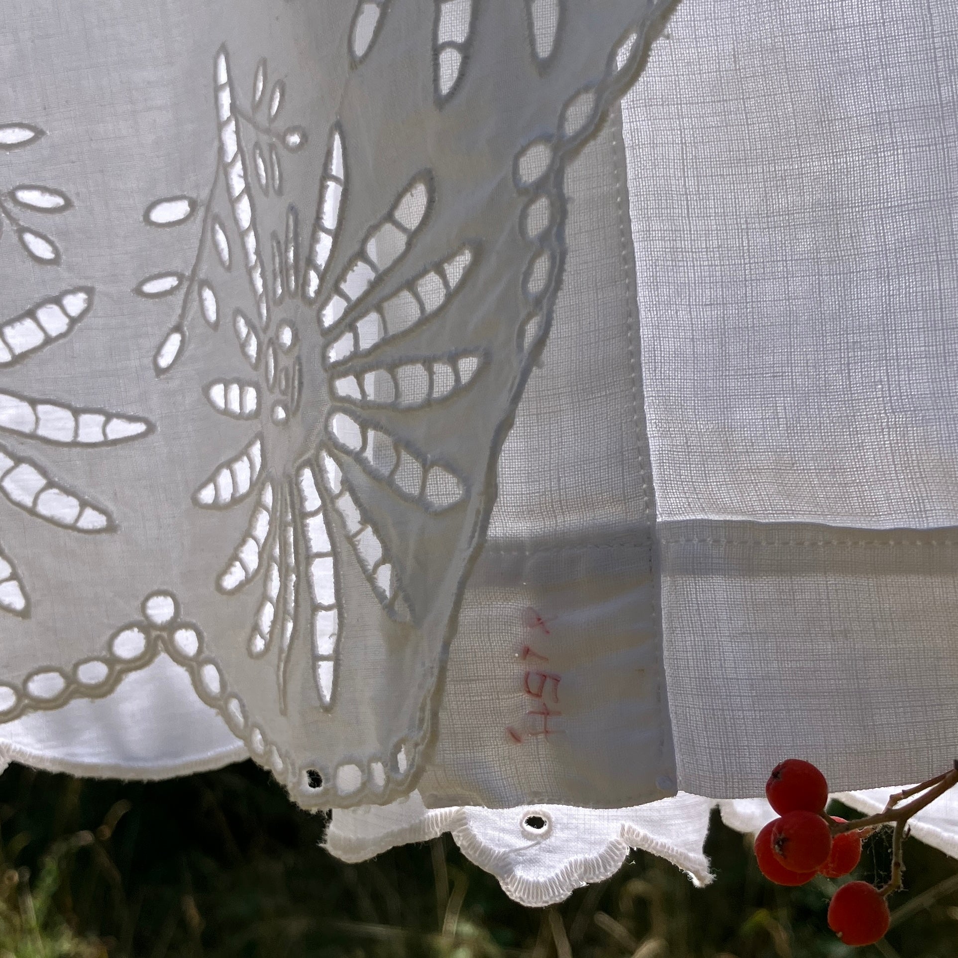 shirt made from a patchwork of recycled vintage white table linen