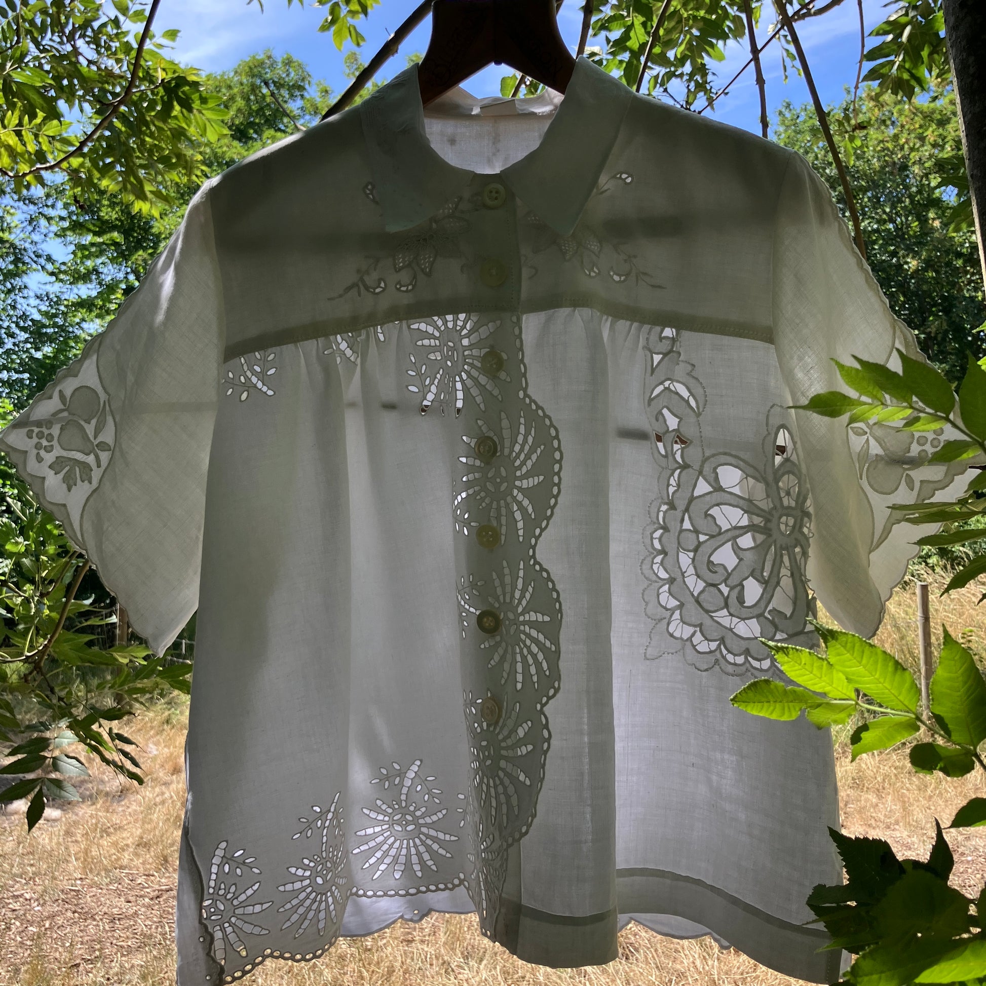 shirt made from a patchwork of recycled vintage white table linen