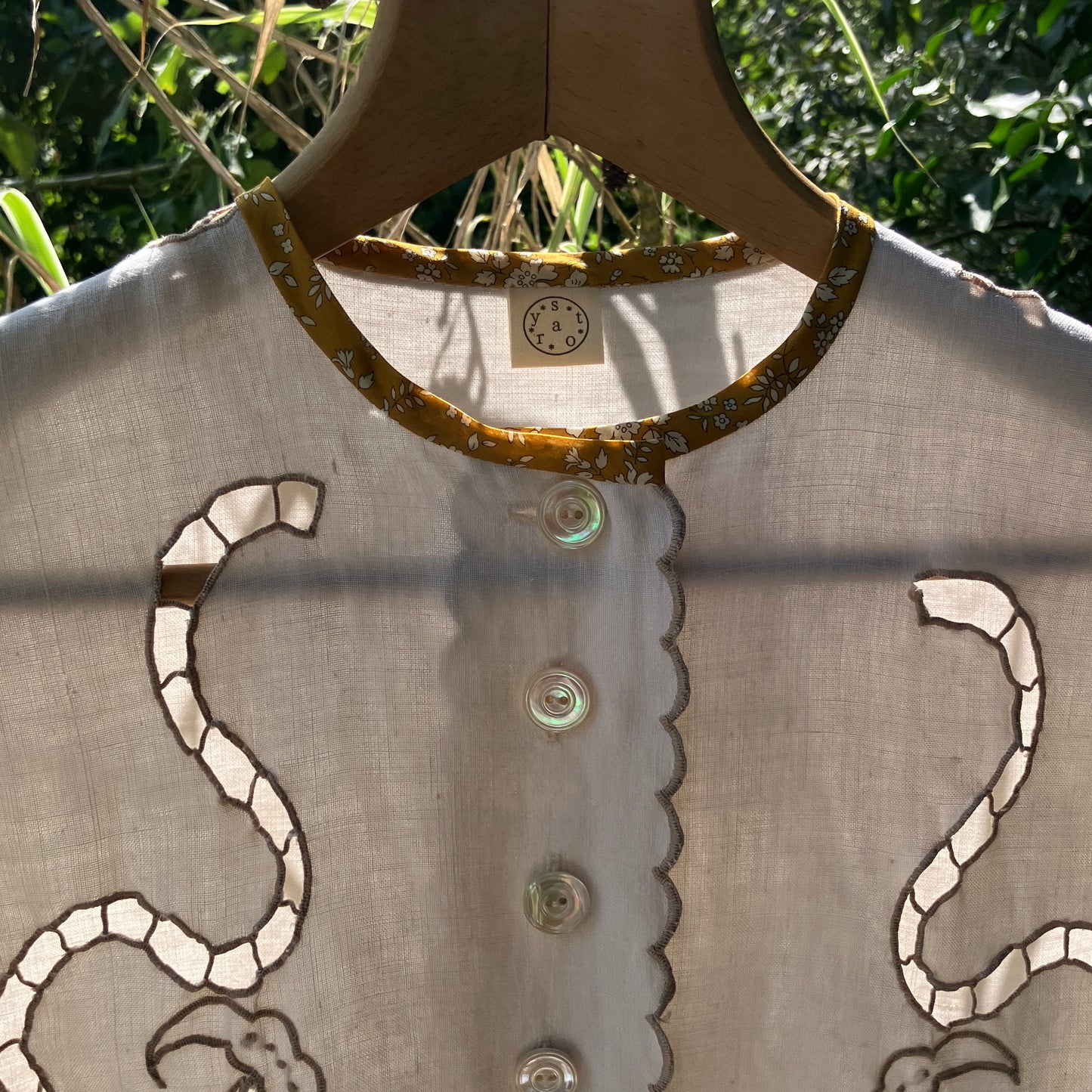 Top made from a vintage cutwork linen tablecloth
