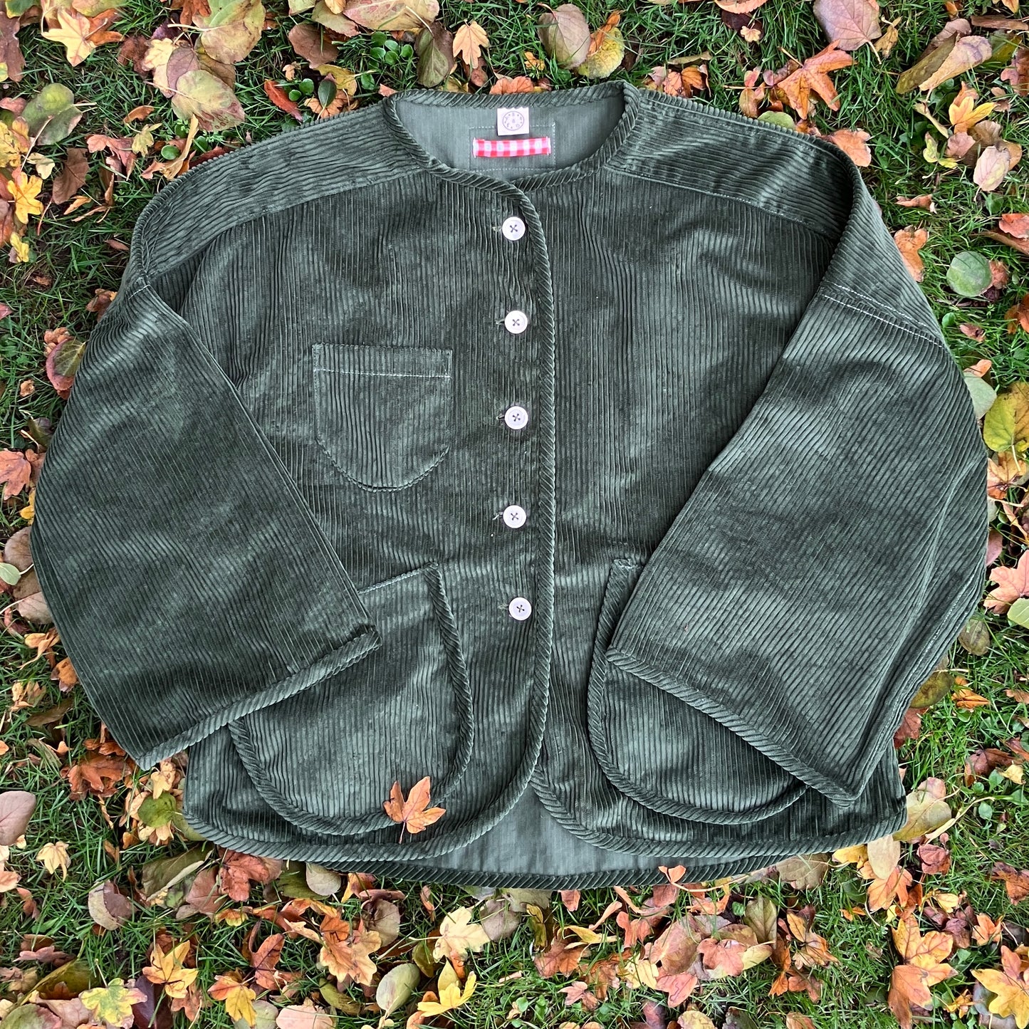 Jacket or shacket made from reclaimed green corduroy