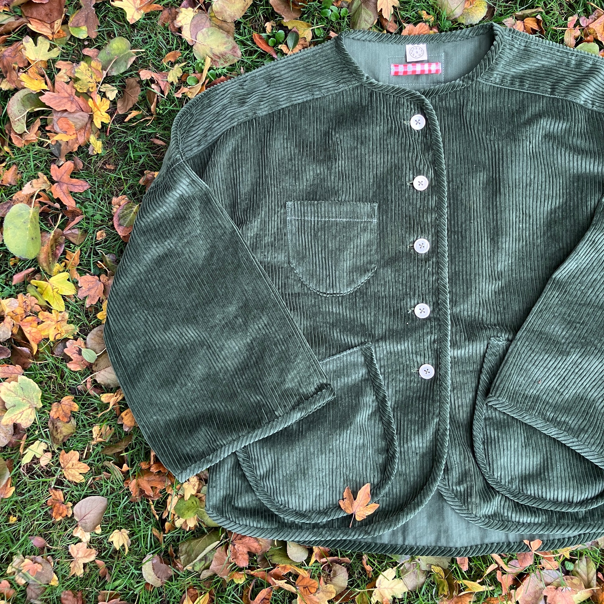 Jacket or shacket made from reclaimed green corduroy