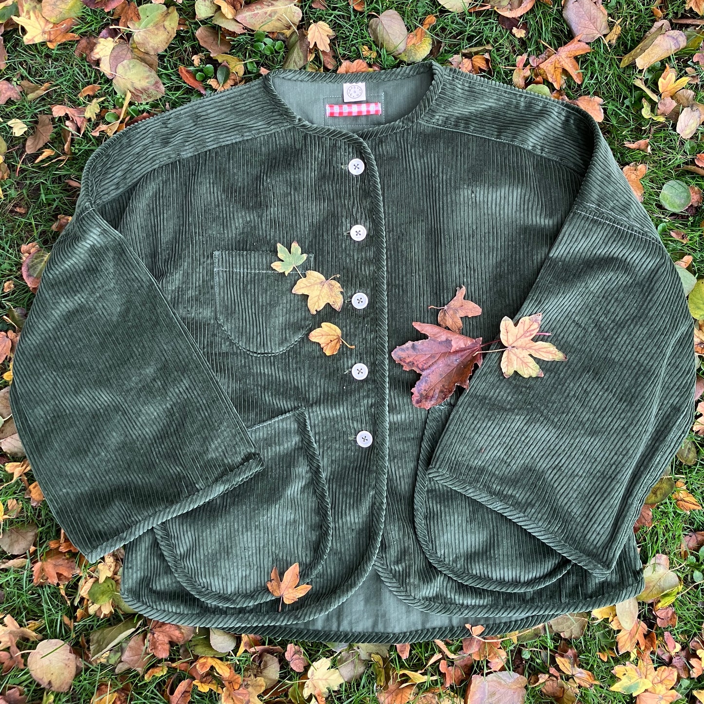 Jacket or shacket made from reclaimed green corduroy