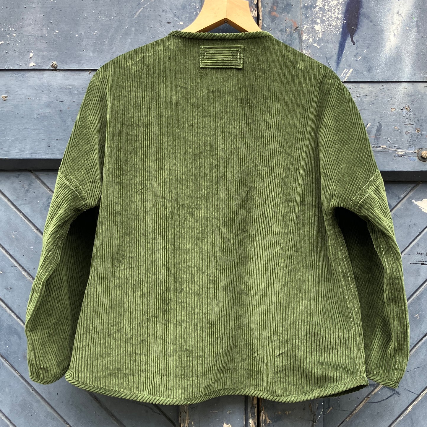 Jacket or shacket made from reclaimed green corduroy