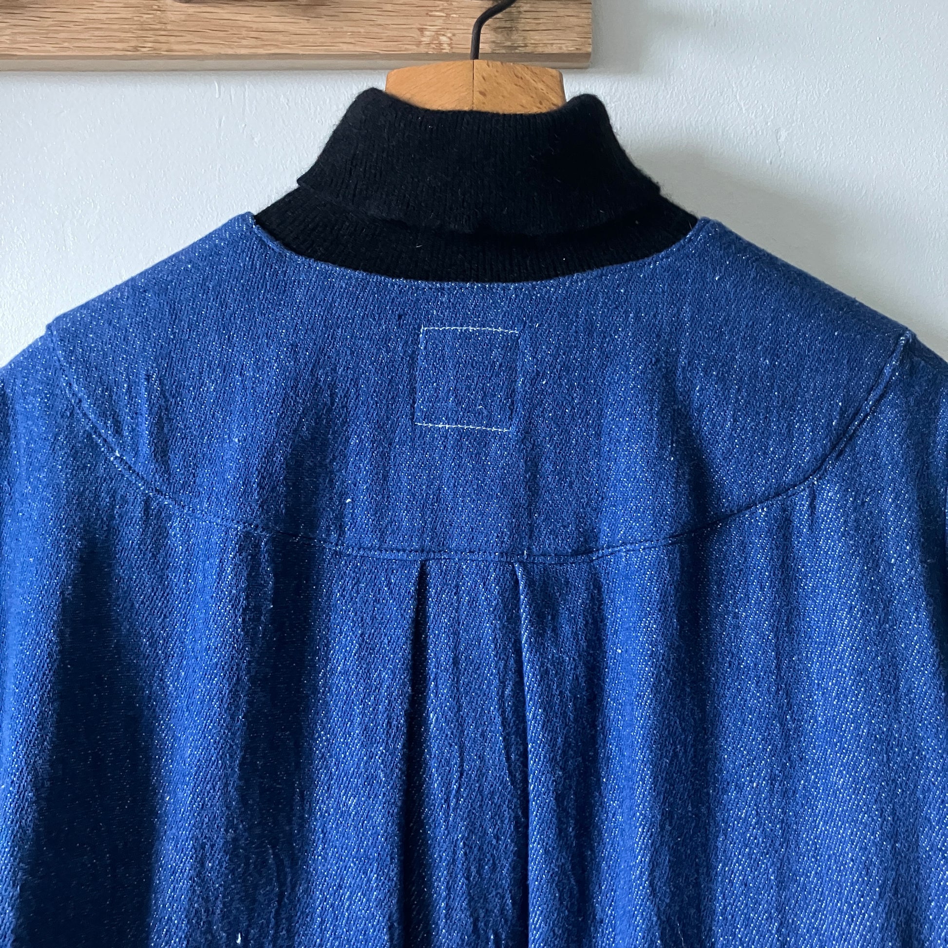 Smock top hand made from deadstock denim with thrifted patchwork hexagons on the pockets