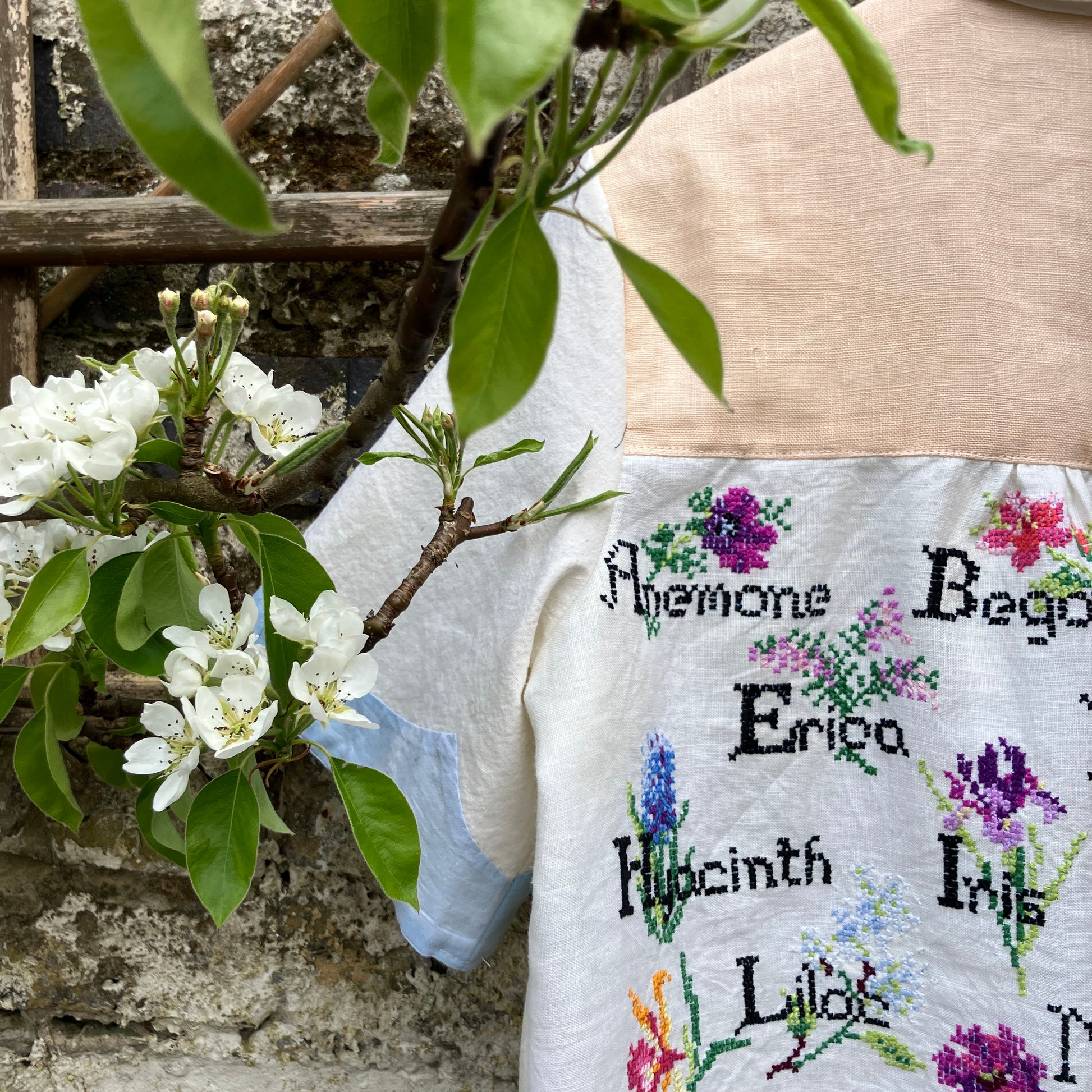 shirt made from vintage cross stitch flowers recycled linen panel