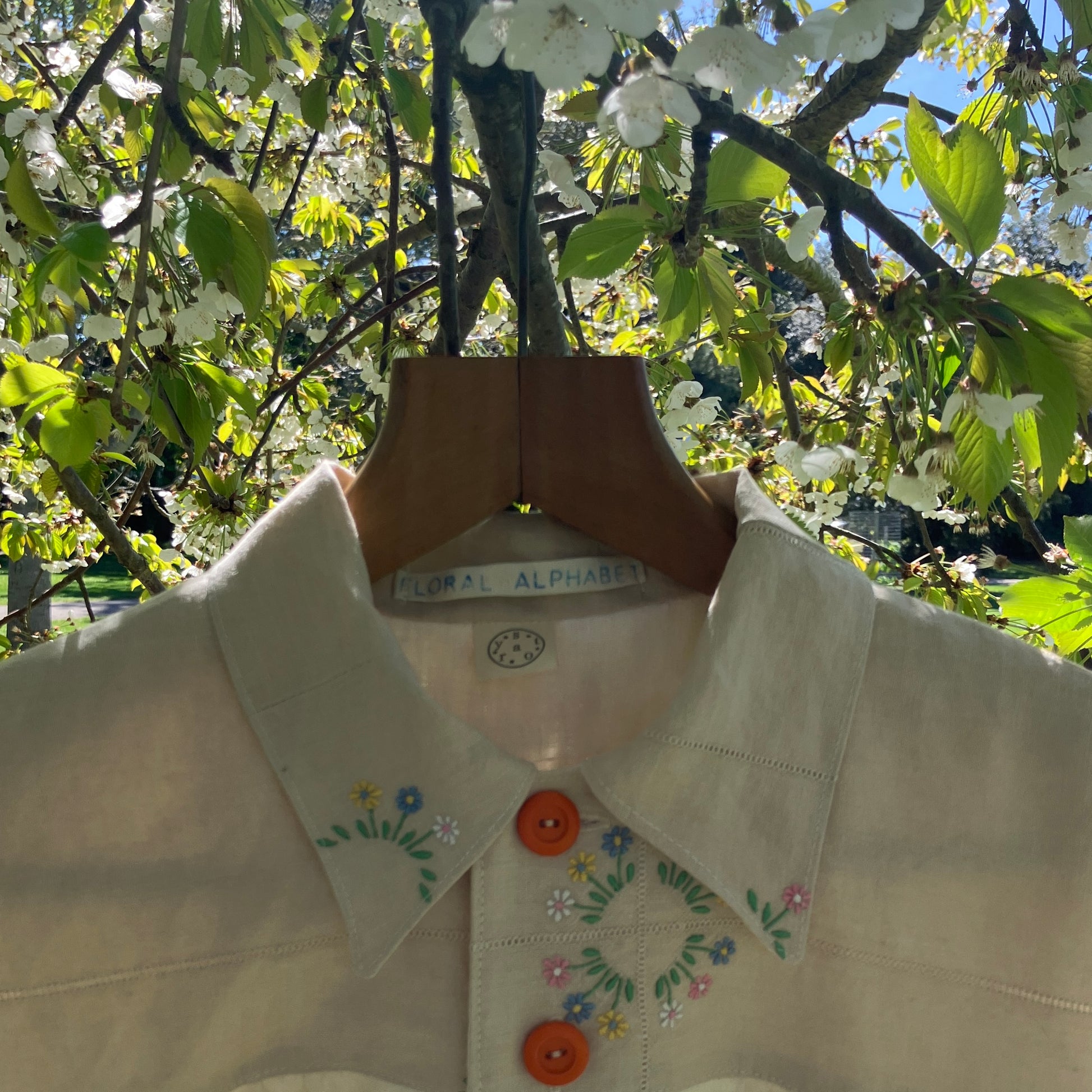 shirt made from vintage cross stitch flowers recycled linen panel
