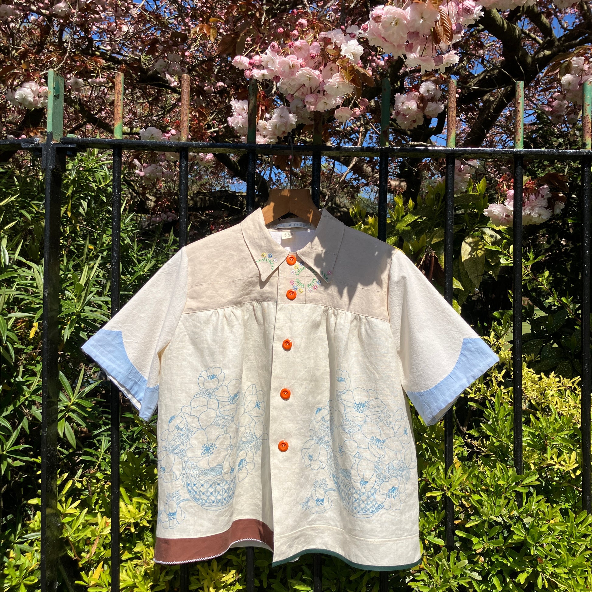 shirt made from vintage cross stitch flowers recycled linen panel