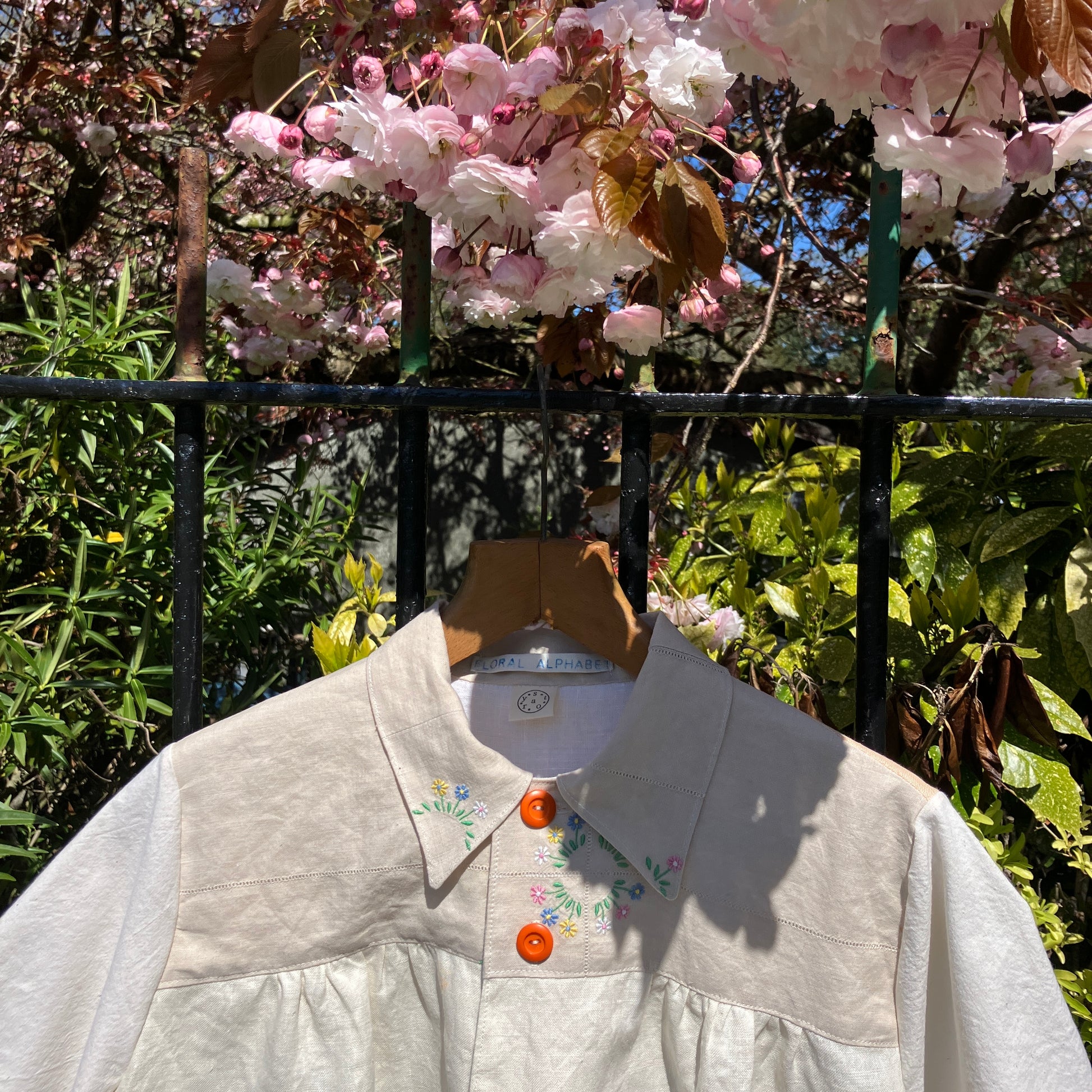 shirt made from vintage cross stitch flowers recycled linen panel