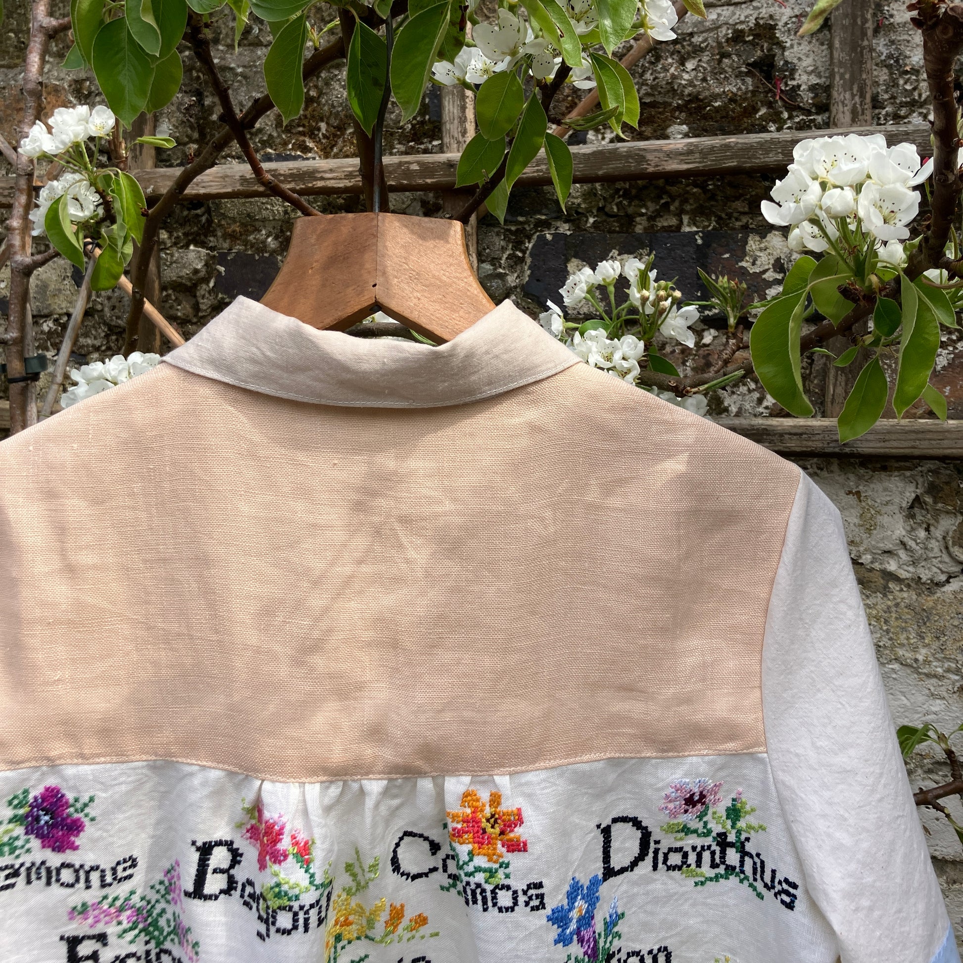 shirt made from vintage cross stitch flowers recycled linen panel