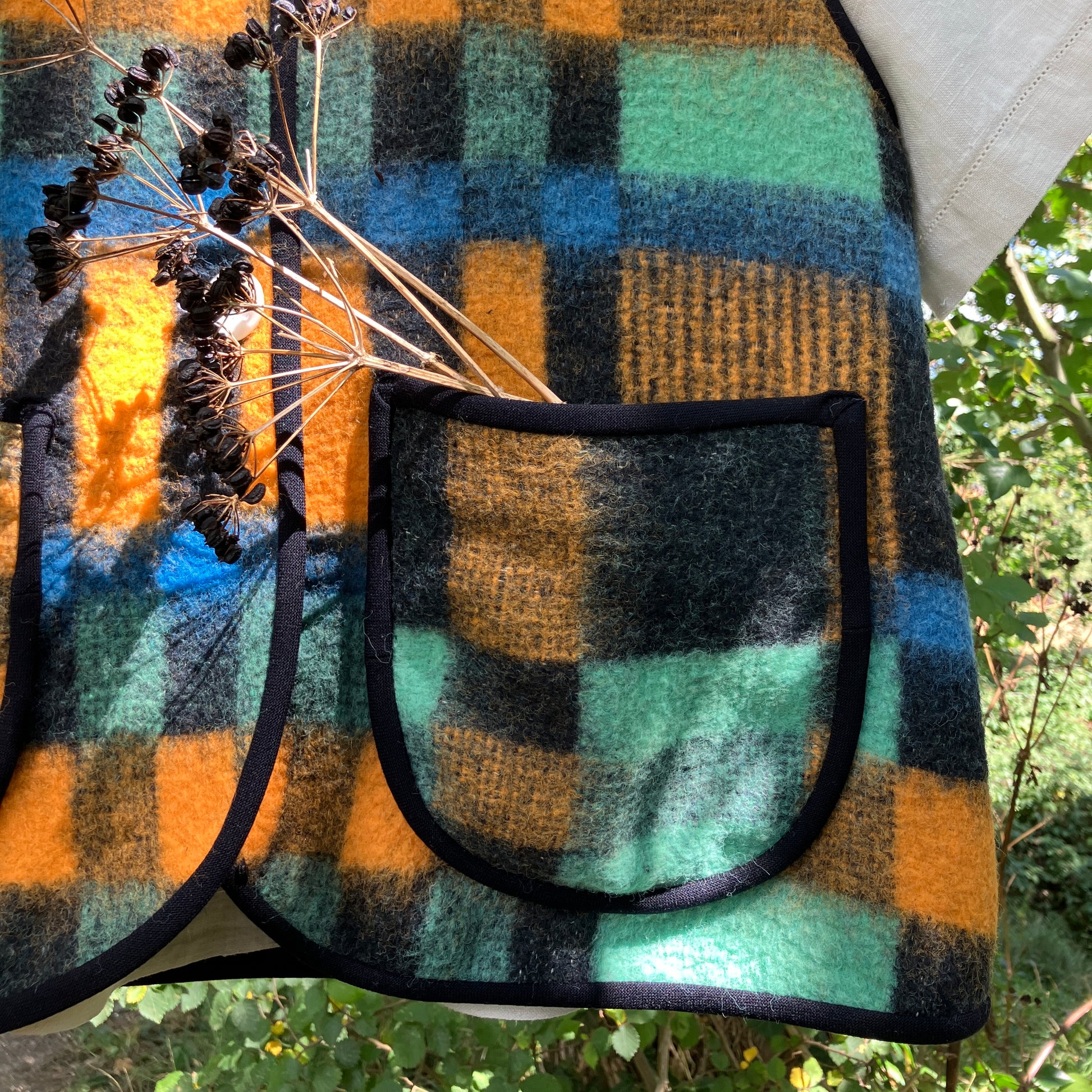 Cosy vest made from a recycled checked wool blanket