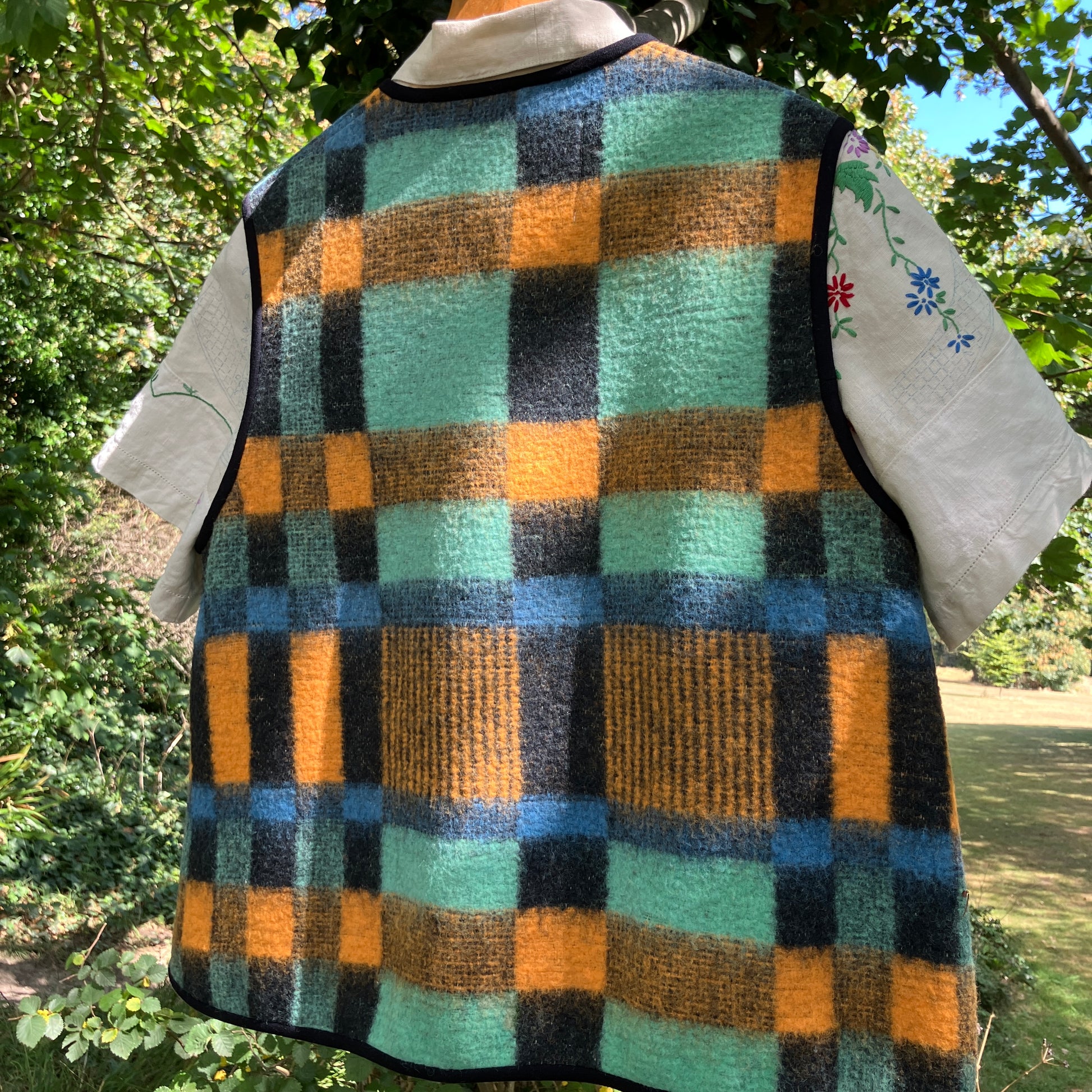 Cosy vest made from a recycled checked wool blanket