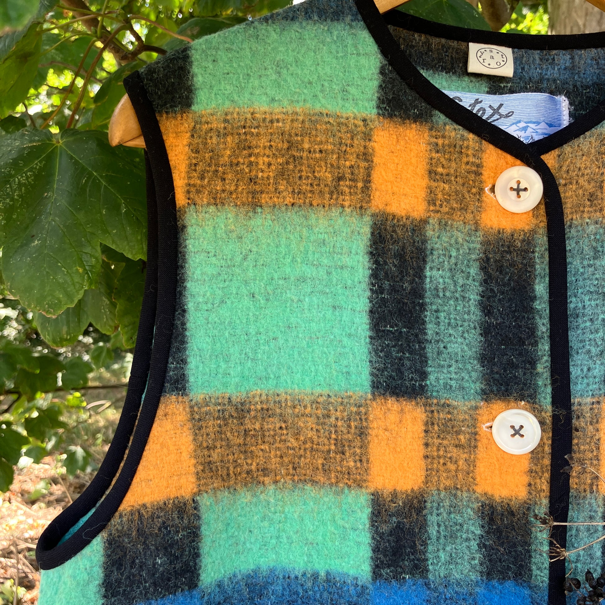 Cosy vest made from a recycled checked wool blanket