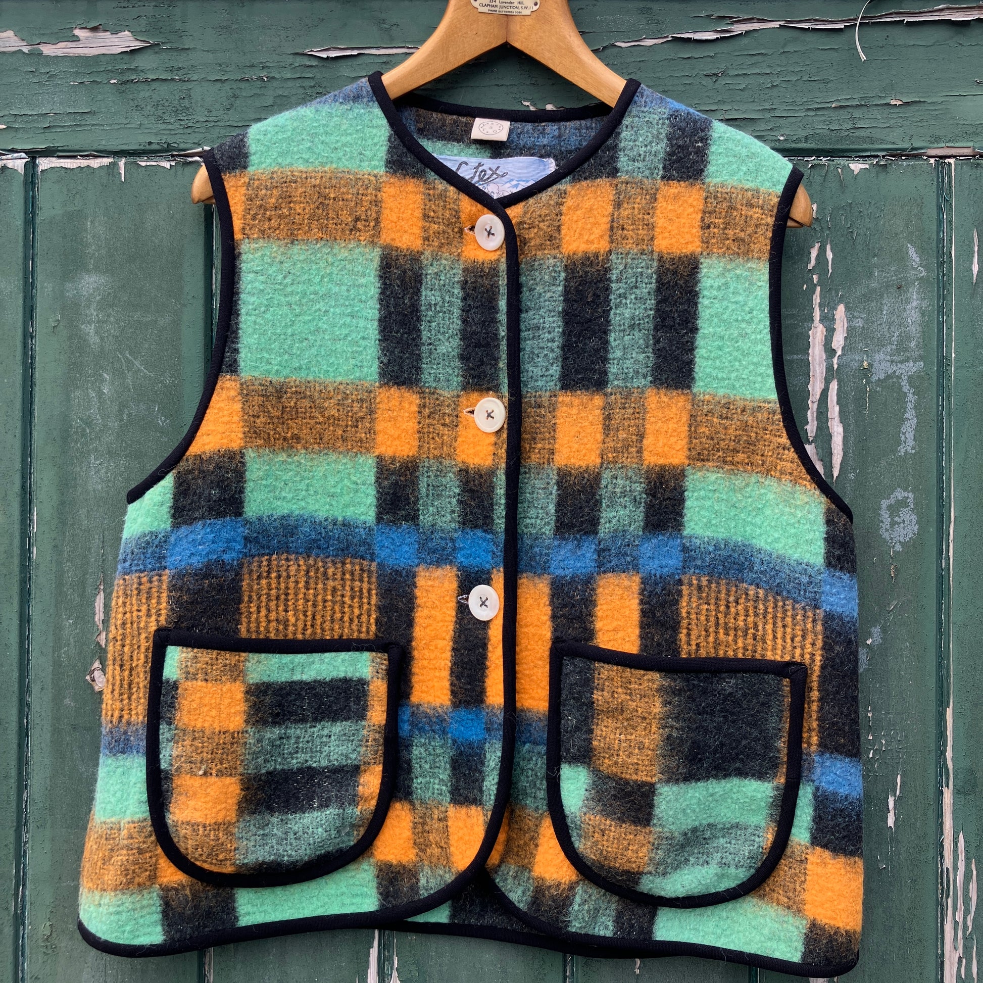 Cosy vest made from a recycled checked wool blanket
