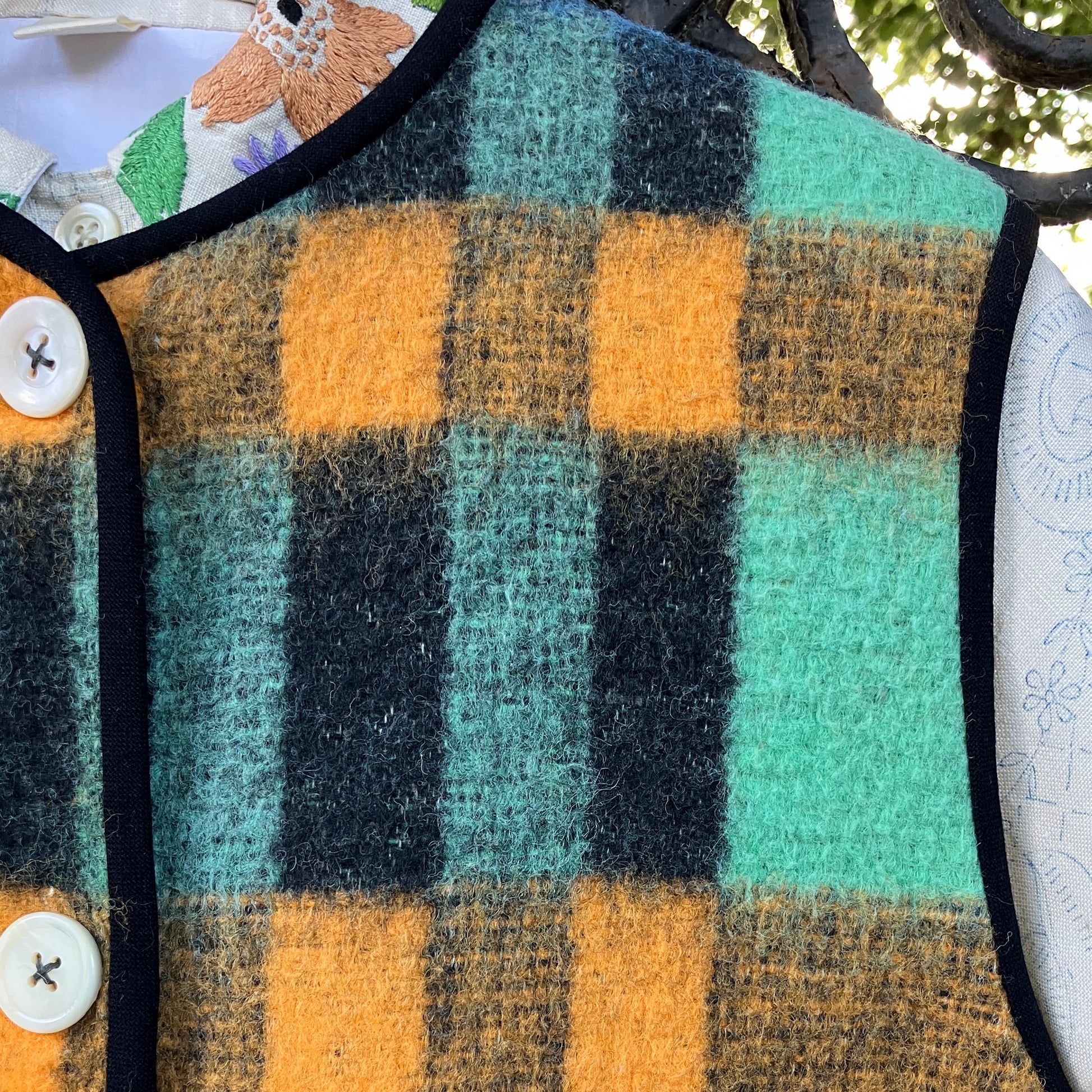 Cosy vest made from a recycled checked wool blanket