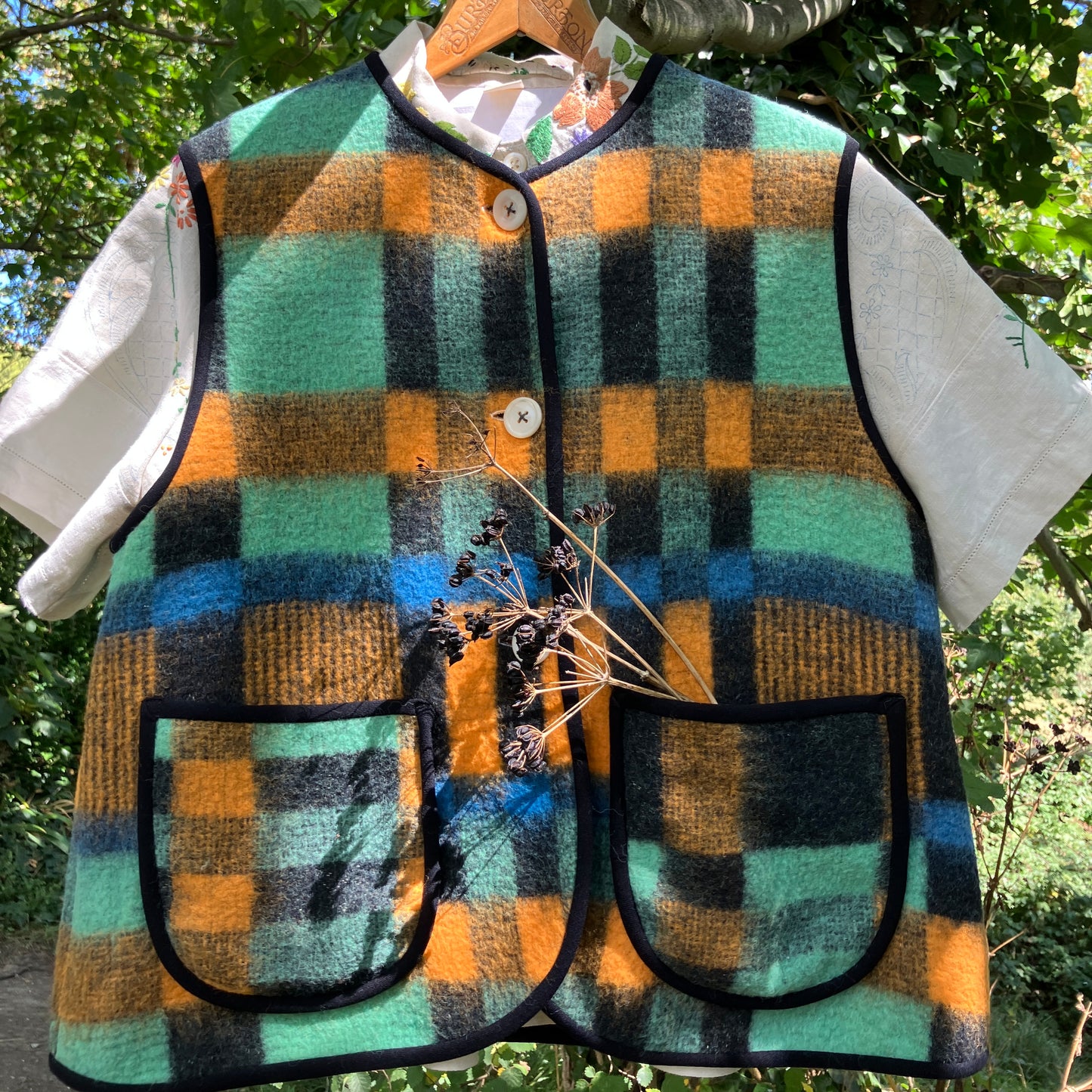 Cosy vest made from a recycled checked wool blanket