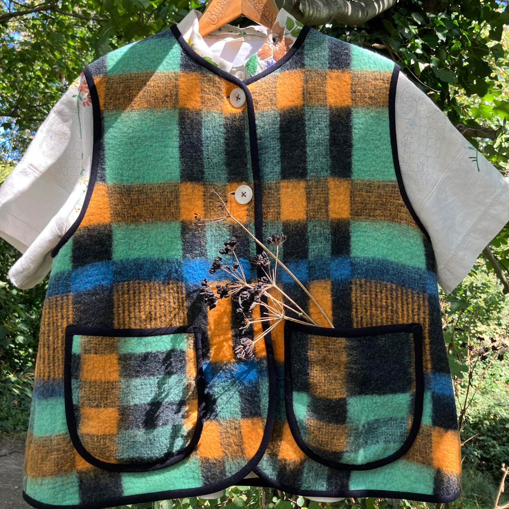 Cosy vest made from a recycled checked wool blanket