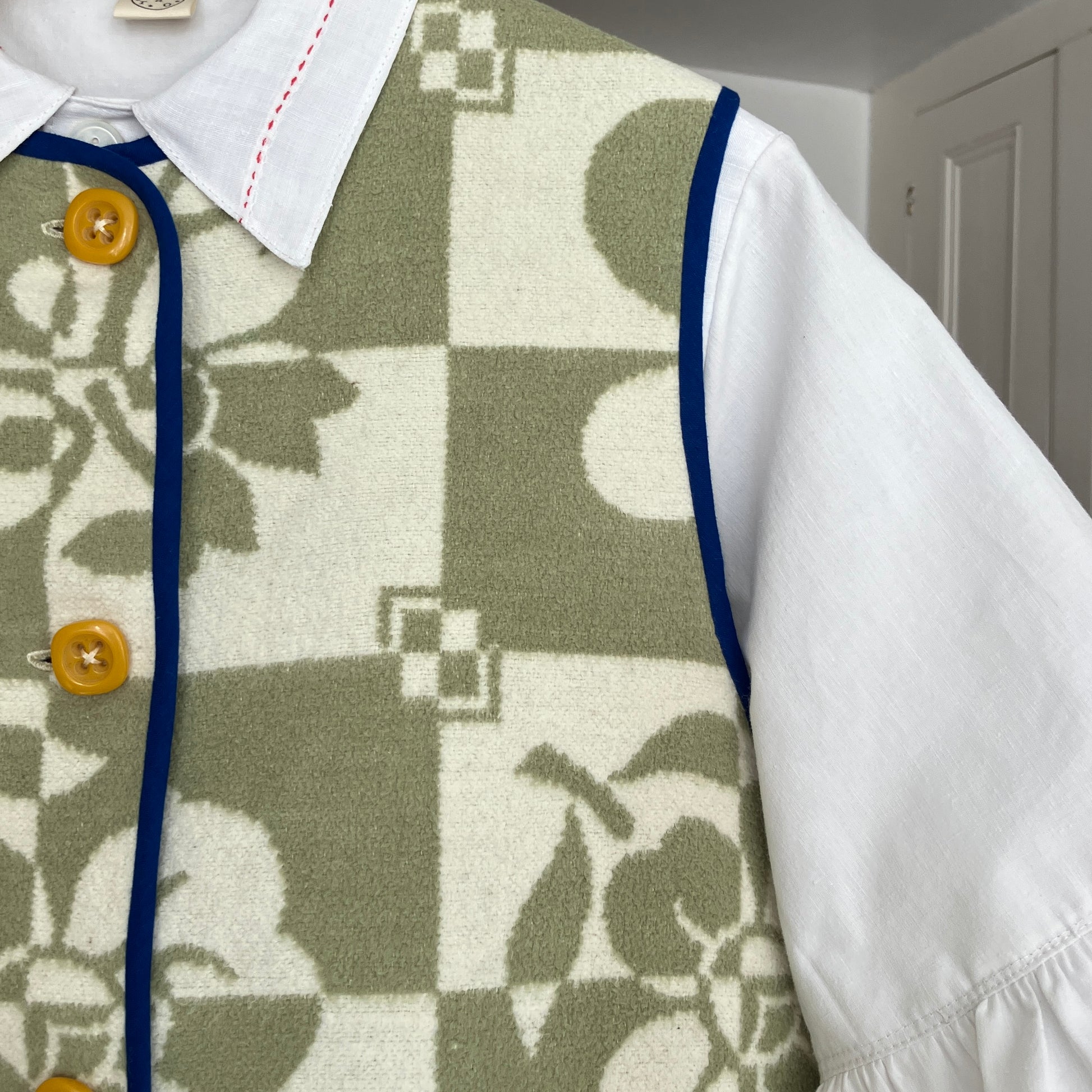 Reclaimed blanket vest in green and white checks and leaves pattern
