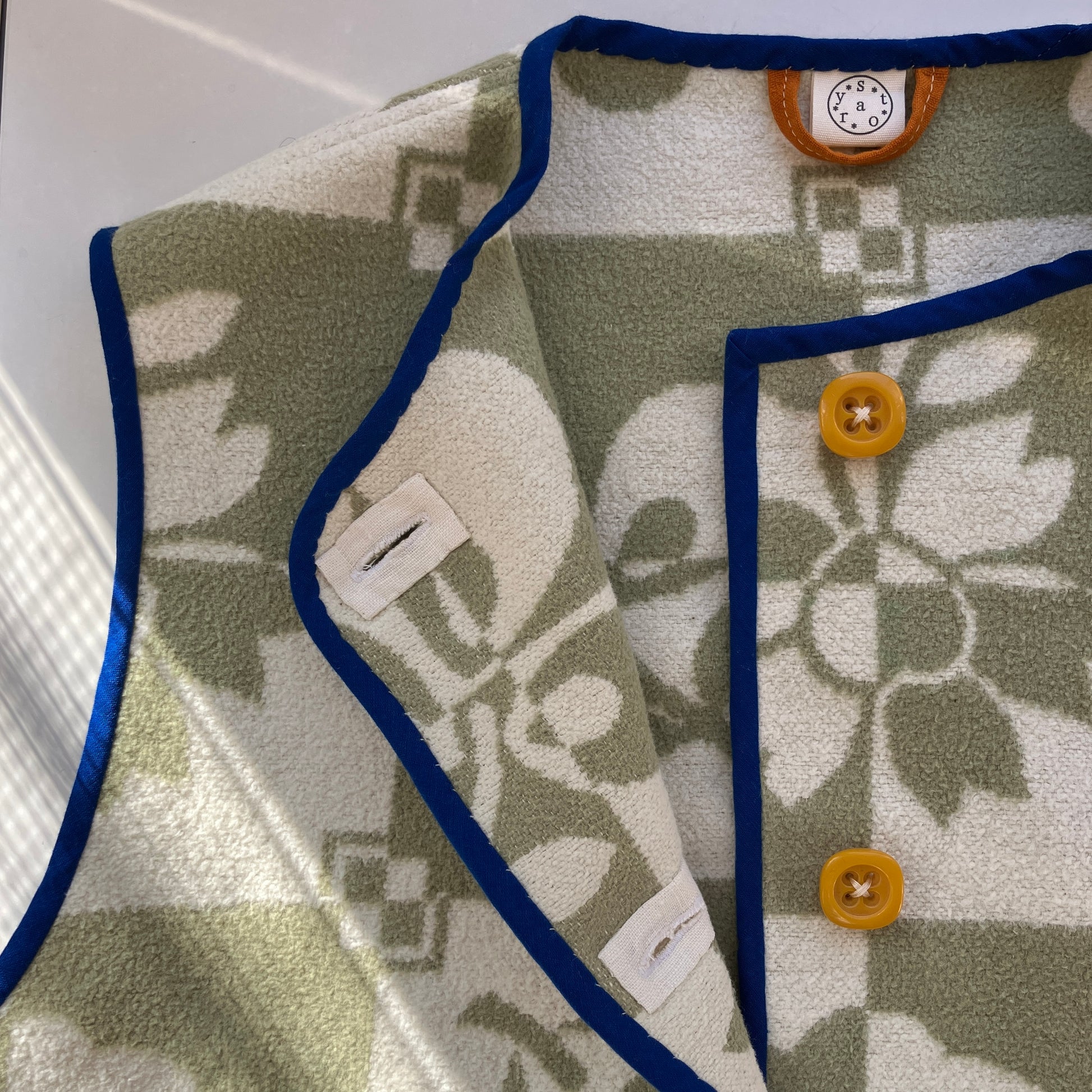 Reclaimed blanket vest in green and white checks and leaves pattern