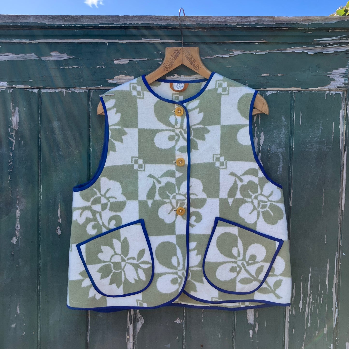 Reclaimed blanket vest in green and white checks and leaves pattern