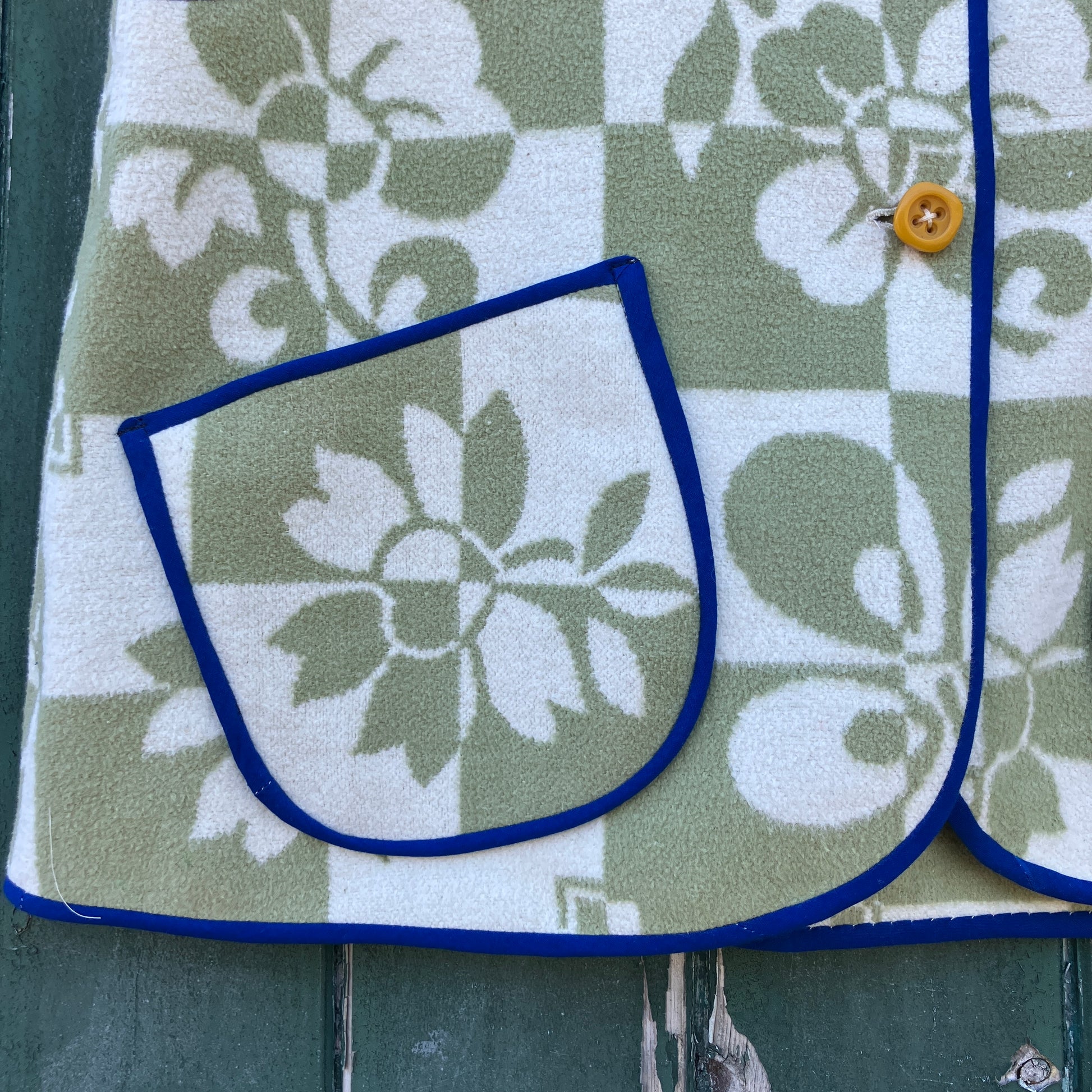 Reclaimed blanket vest in green and white checks and leaves pattern