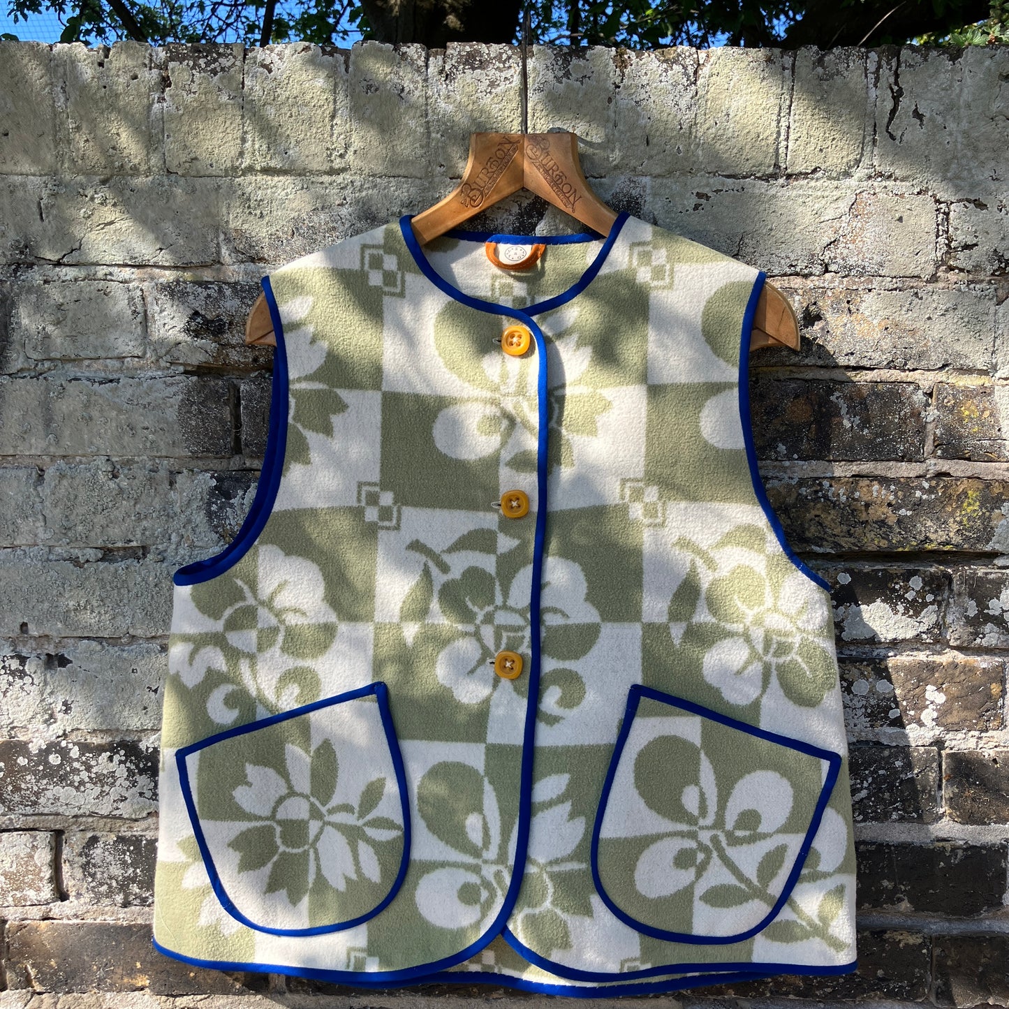 Reclaimed blanket vest in green and white checks and leaves pattern