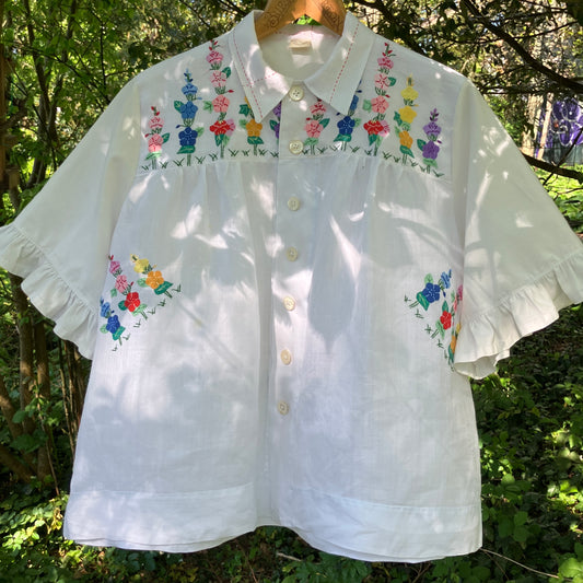 Blouse with ruffle sleeves made from a reclaimed linen tablecloth with floral applique