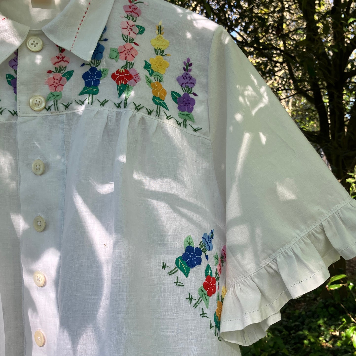 Blouse with ruffle sleeves made from a reclaimed linen tablecloth with floral applique
