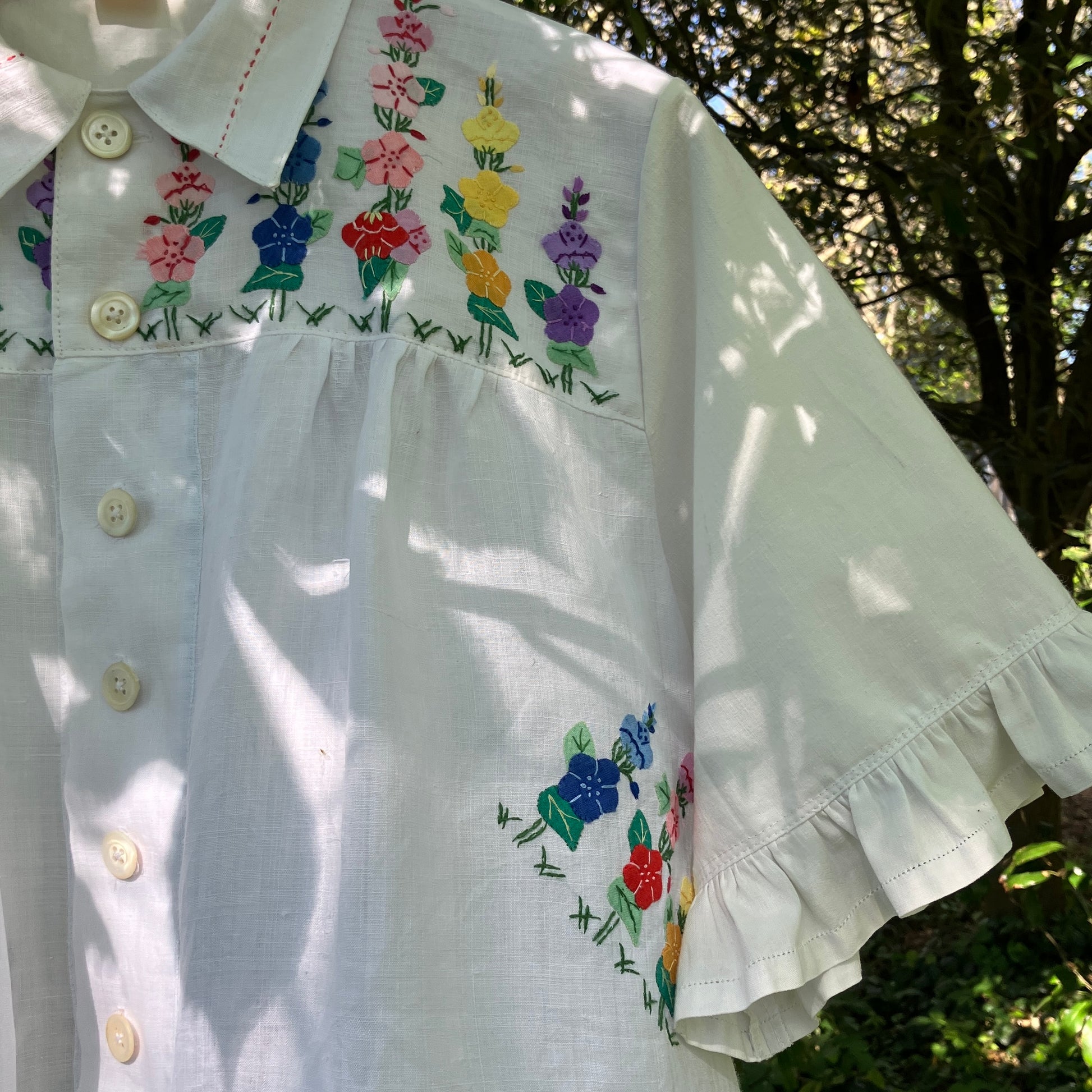 Blouse with ruffle sleeves made from a reclaimed linen tablecloth with floral applique