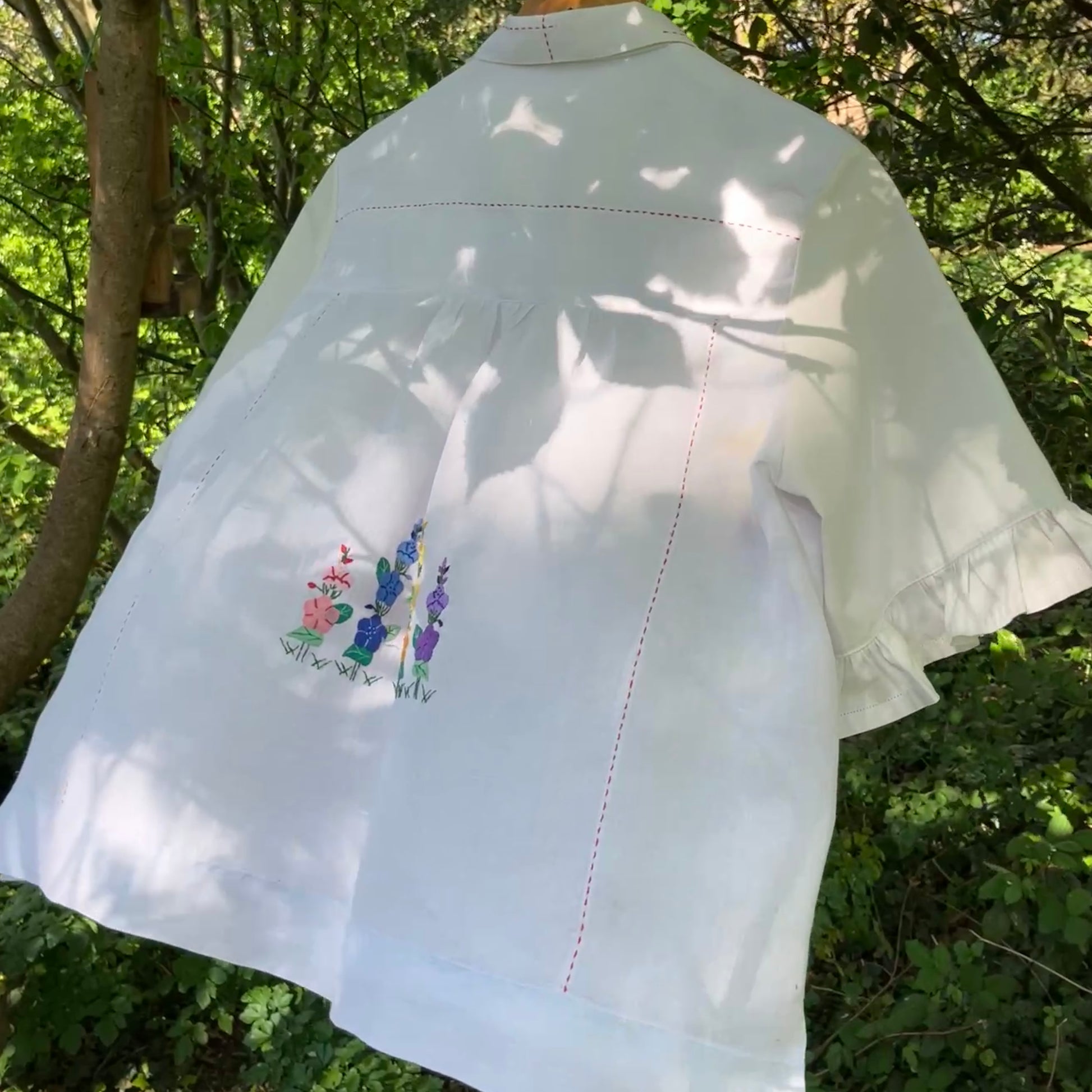 Blouse with ruffle sleeves made from a reclaimed linen tablecloth with floral applique