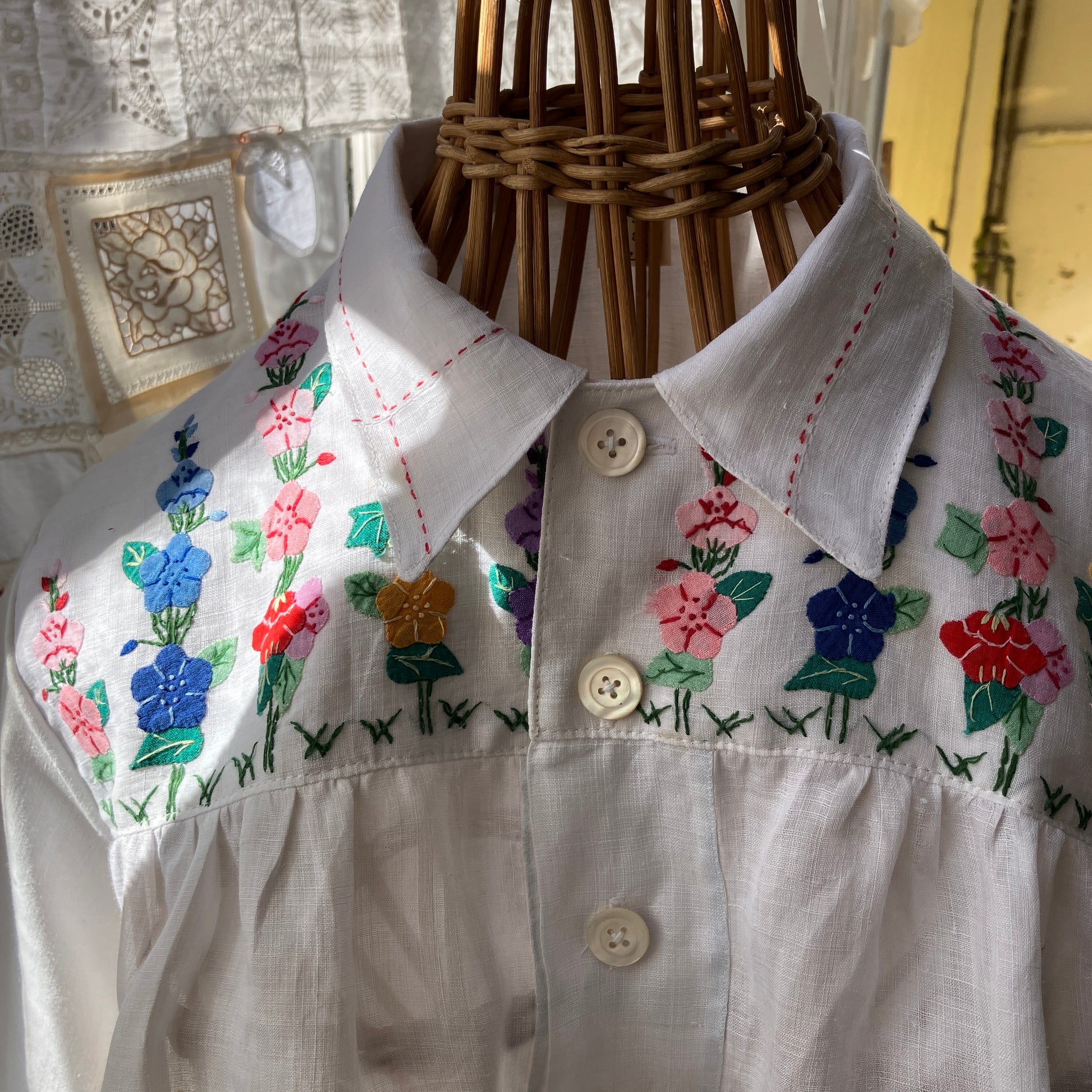 Blouse with ruffle sleeves made from a reclaimed linen tablecloth with floral applique