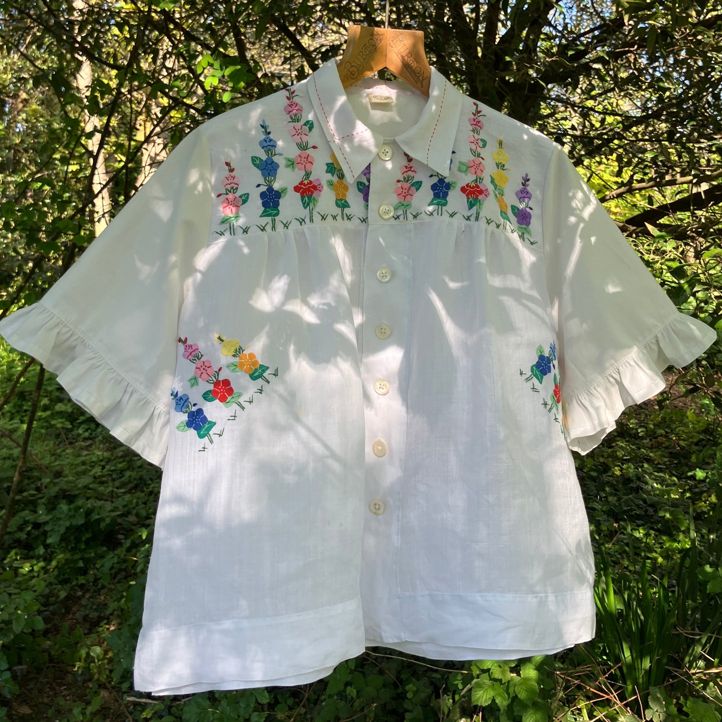 Blouse with ruffle sleeves made from a reclaimed linen tablecloth with floral applique