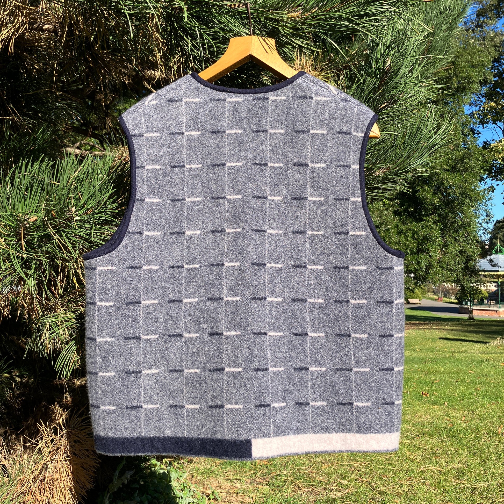 Cosy vest made from a reclaimed grey and blue lambswool blanket with two tie fastenings