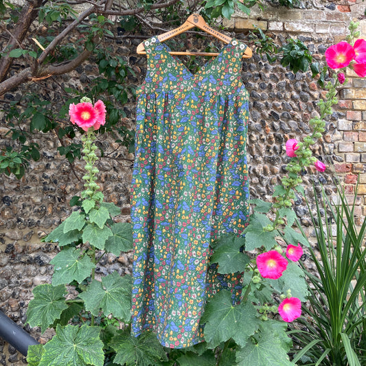 Button-shoulder, below-knee dress made from a reclaimed vintage 60s/70s Liberty Print curtain in a pretty floral print.