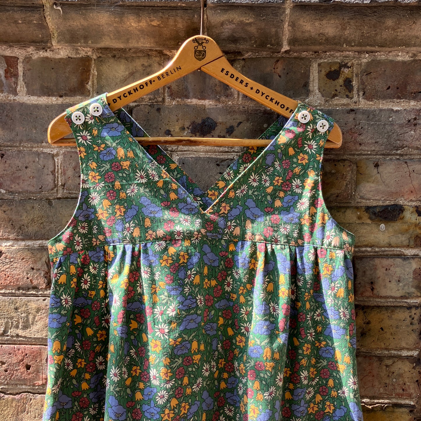 Button-shoulder, below-knee dress made from a reclaimed vintage 60s/70s Liberty Print curtain in a pretty floral print.