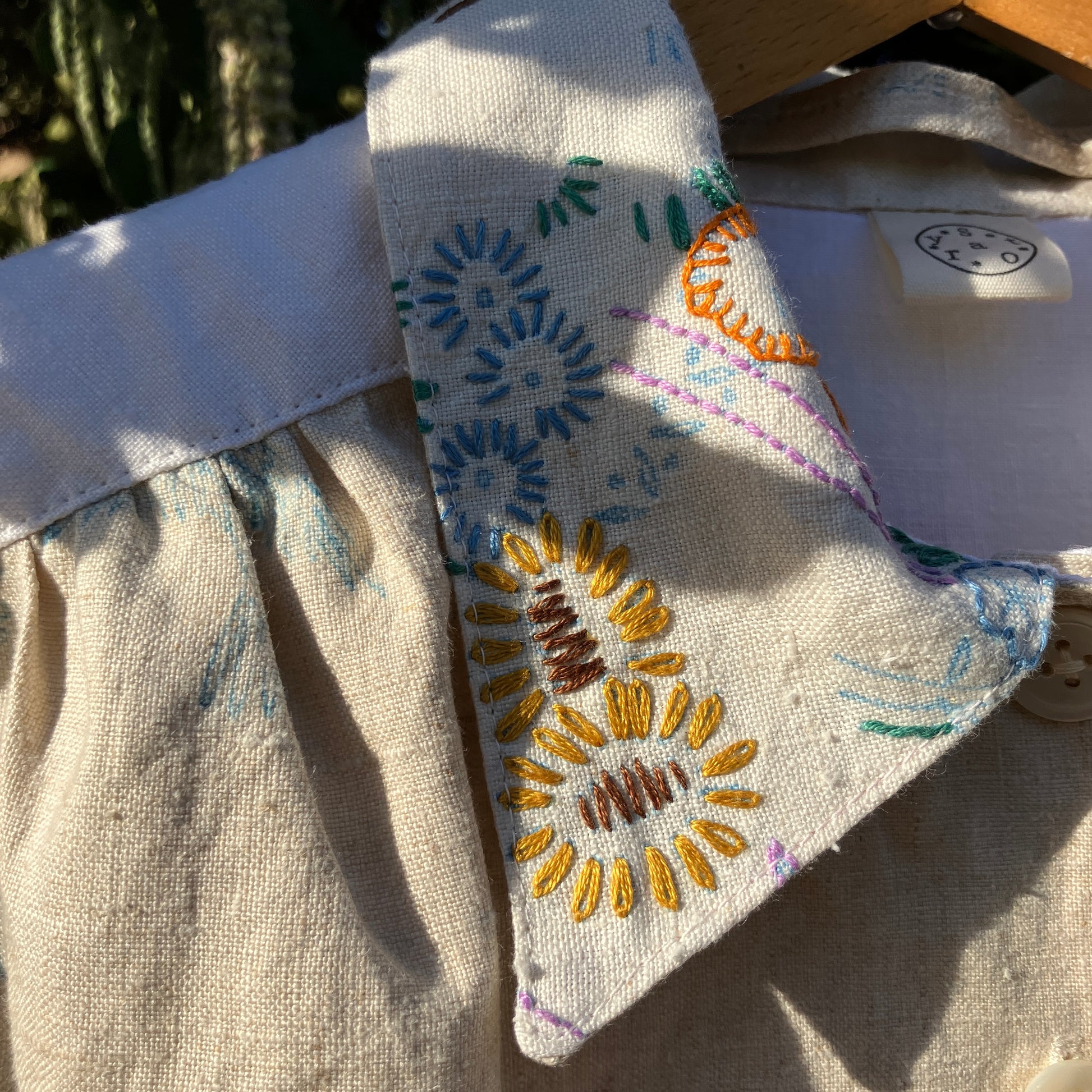 shirt made from bird-themed vintage embroidered recycled tablecloths