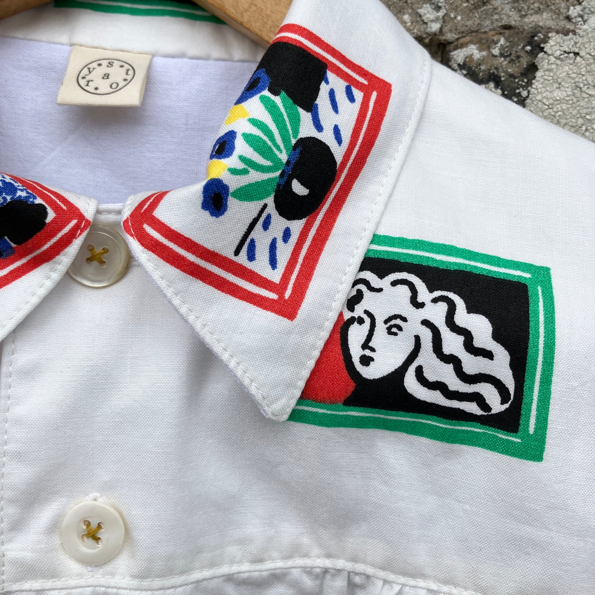 shirt made from 80s deadstock fabric with a print of tiny paintings in frames