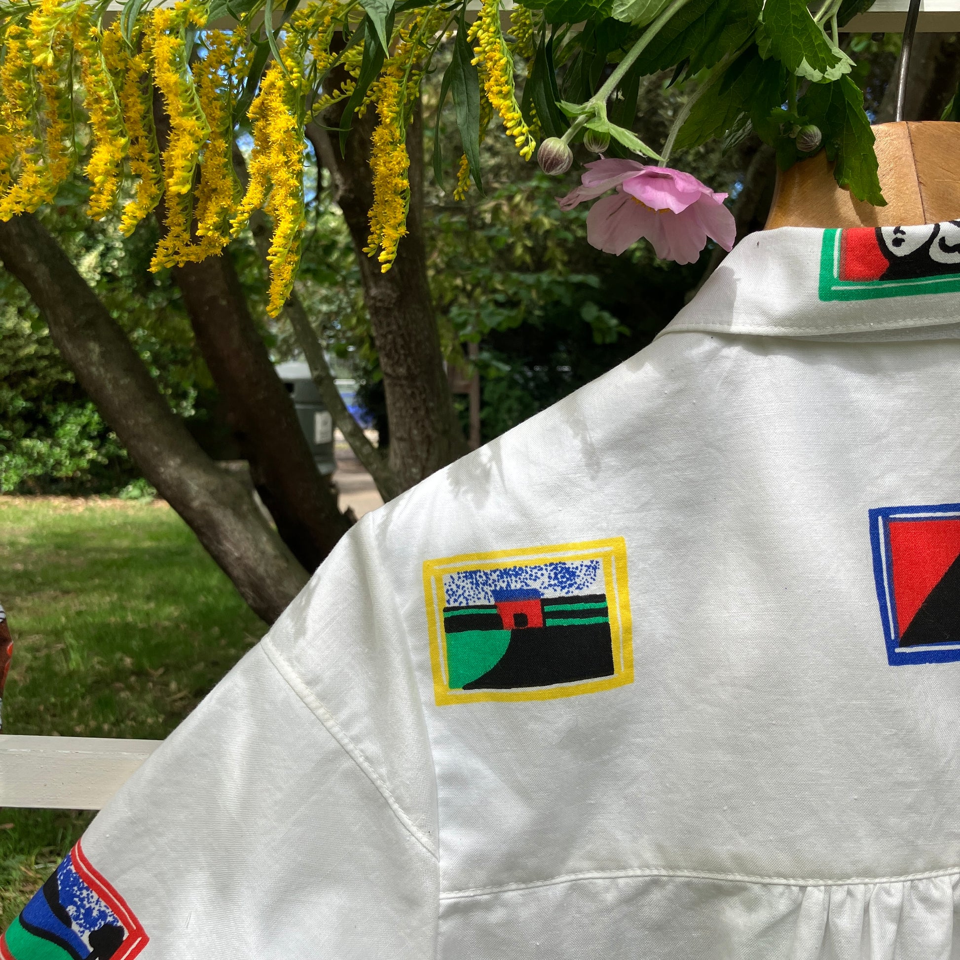 shirt made from 80s deadstock fabric with a print of tiny paintings in frames