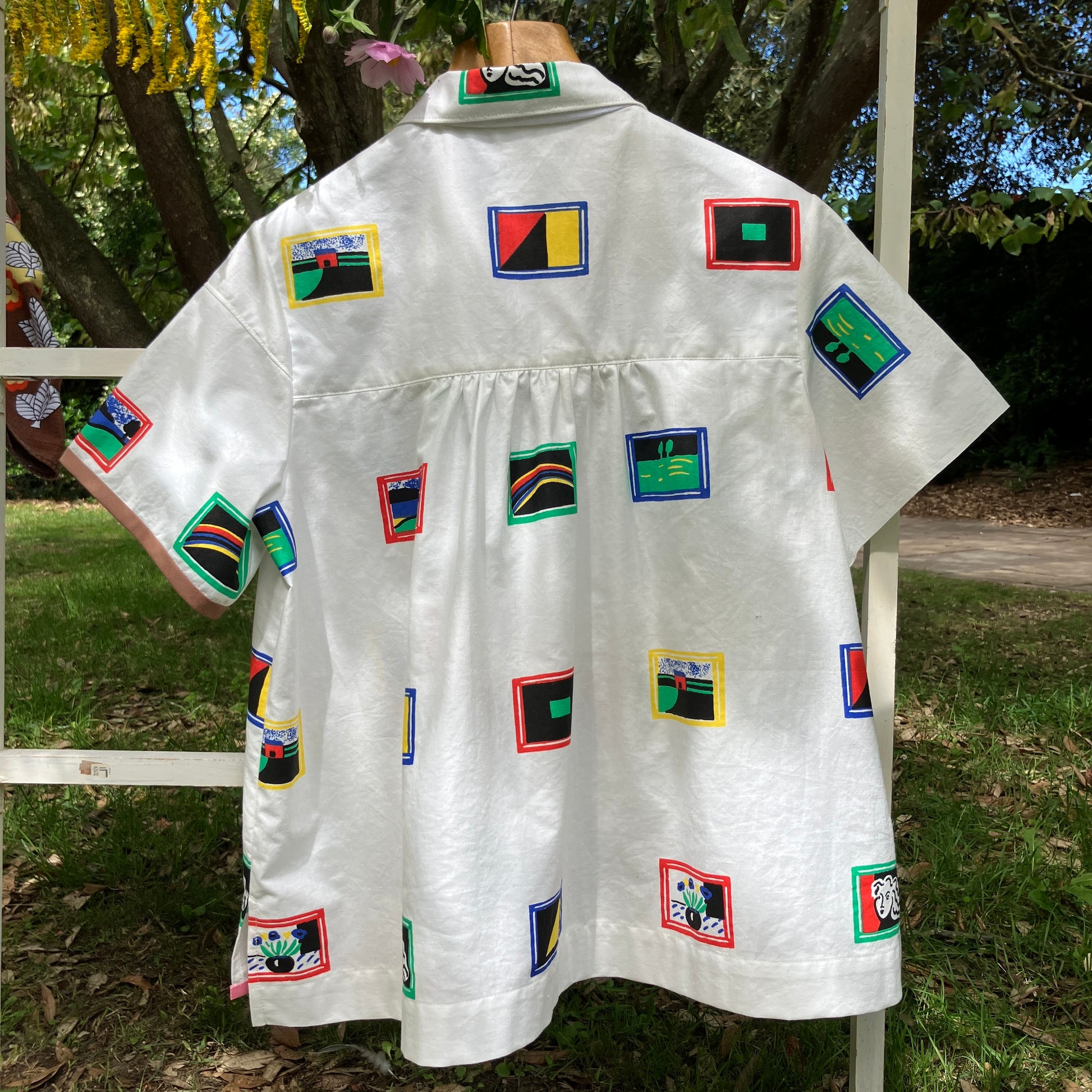shirt made from 80s deadstock fabric with a print of tiny paintings in frames