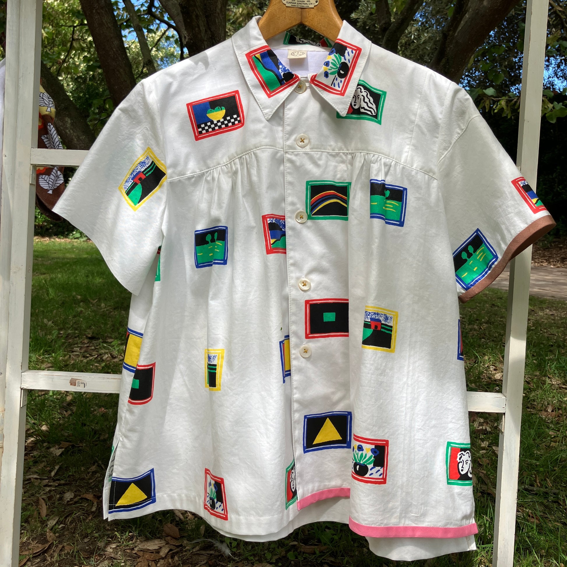 shirt made from 80s deadstock fabric with a print of tiny paintings in frames