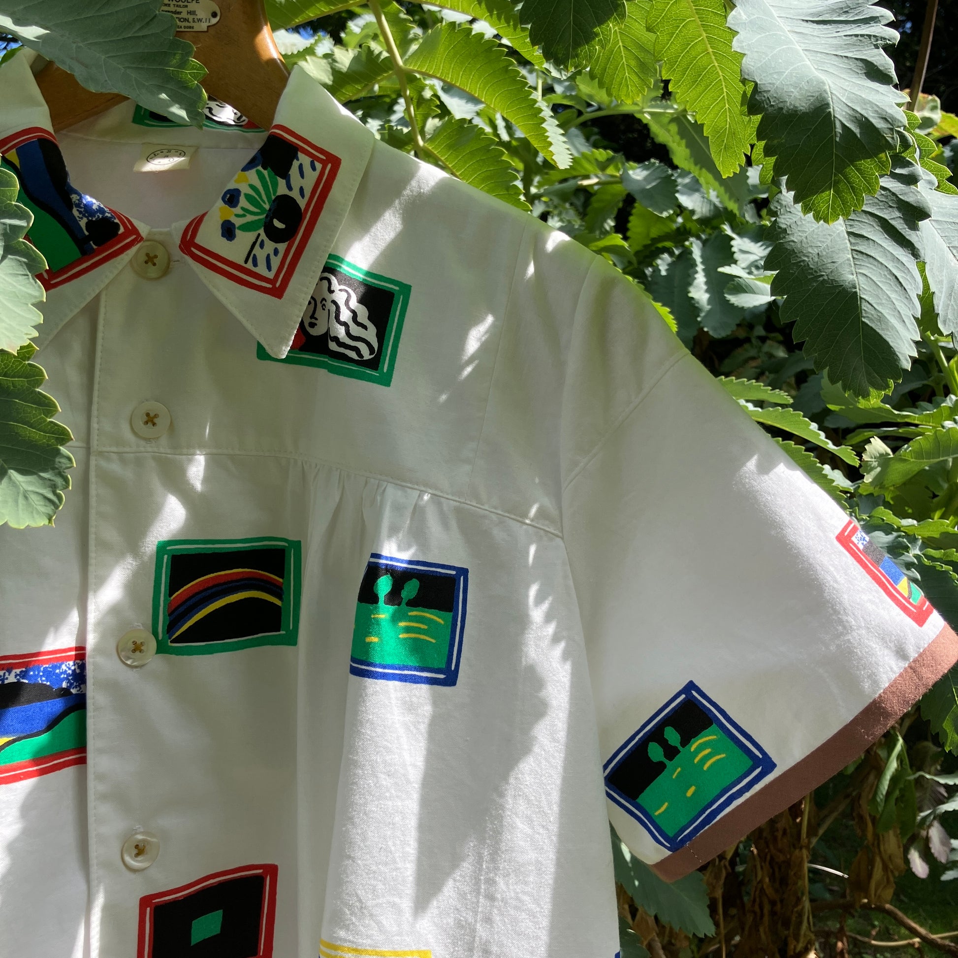 shirt made from 80s deadstock fabric with a print of tiny paintings in frames