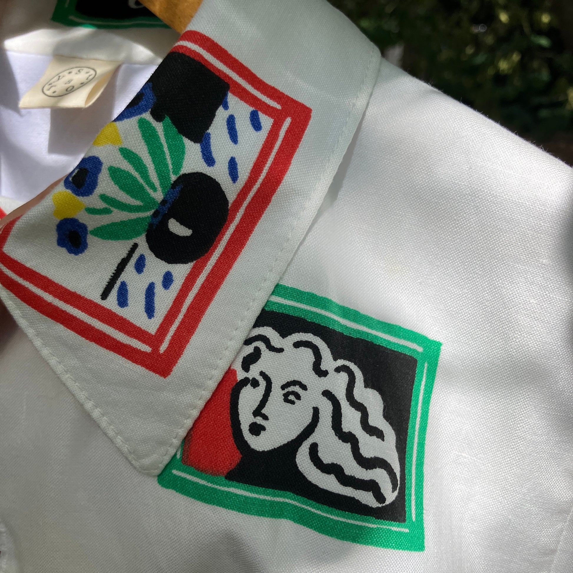 shirt made from 80s deadstock fabric with a print of tiny paintings in frames