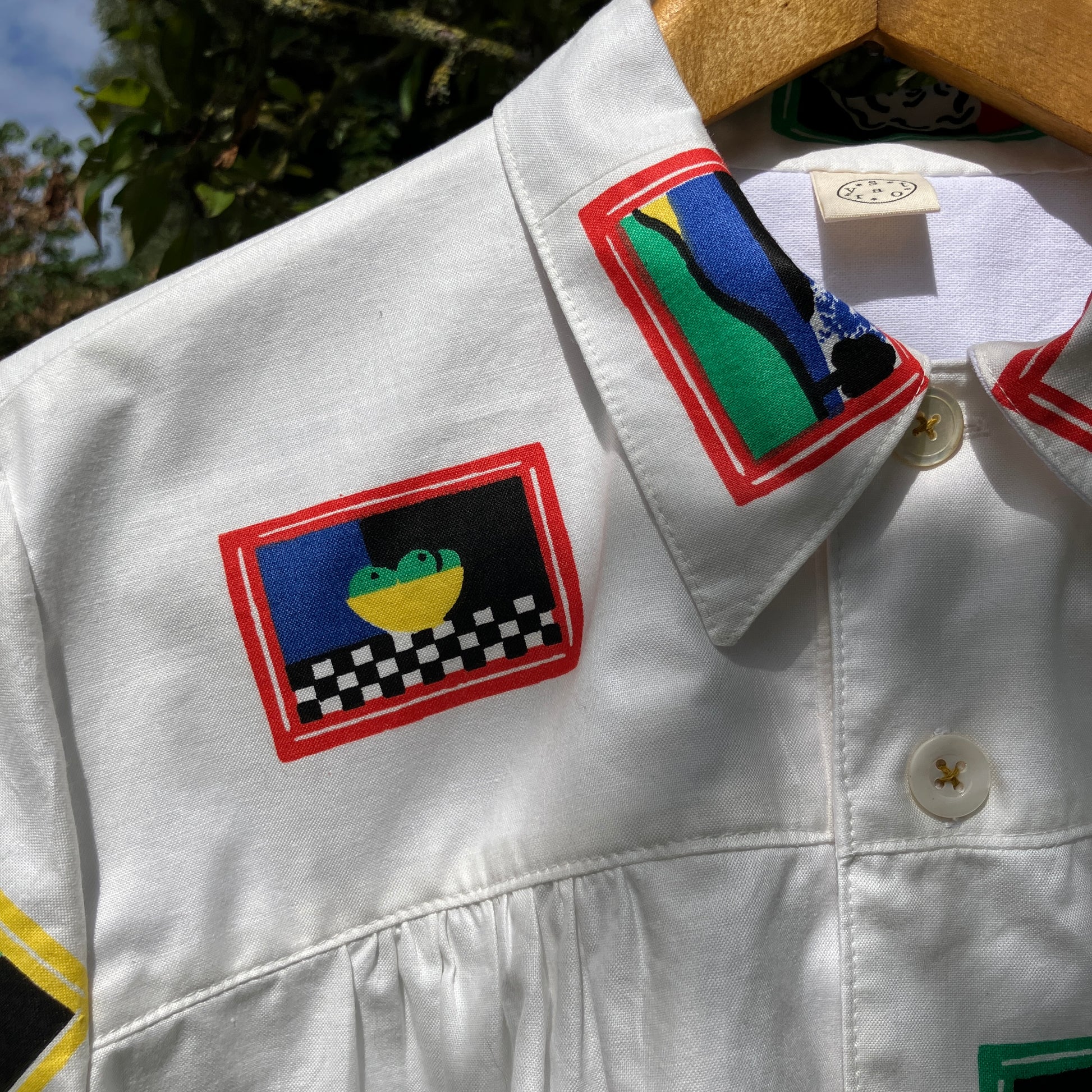 shirt made from 80s deadstock fabric with a print of tiny paintings in frames