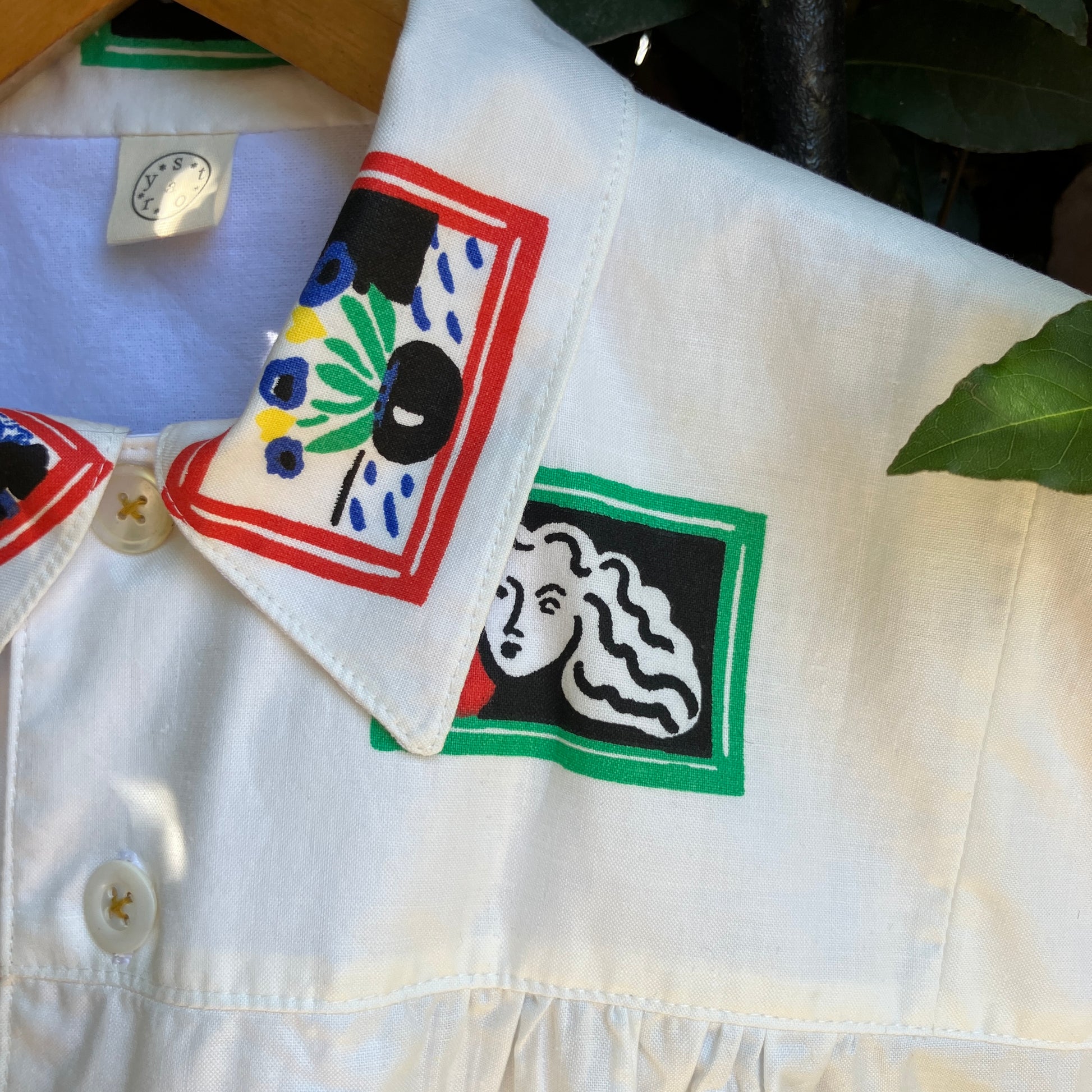 shirt made from 80s deadstock fabric with a print of tiny paintings in frames