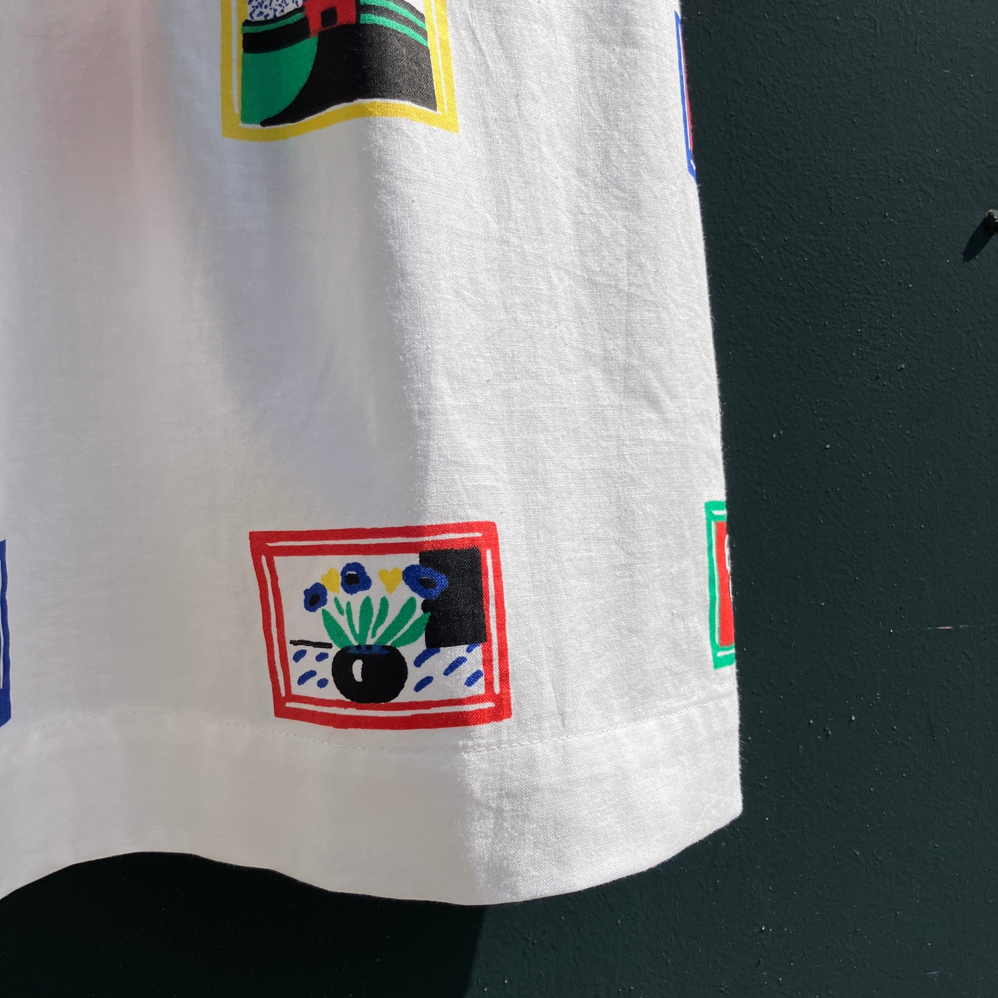 shirt made from 80s deadstock fabric with a print of tiny paintings in frames