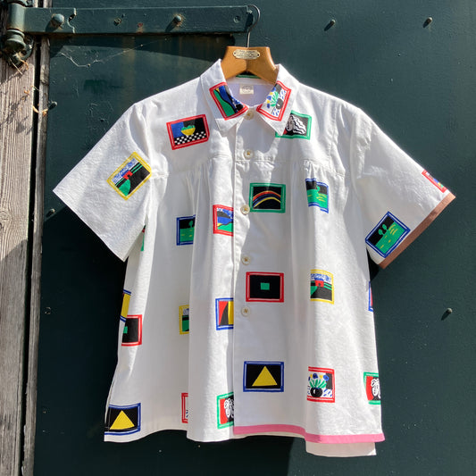 shirt made from 80s deadstock fabric with a print of tiny paintings in frames